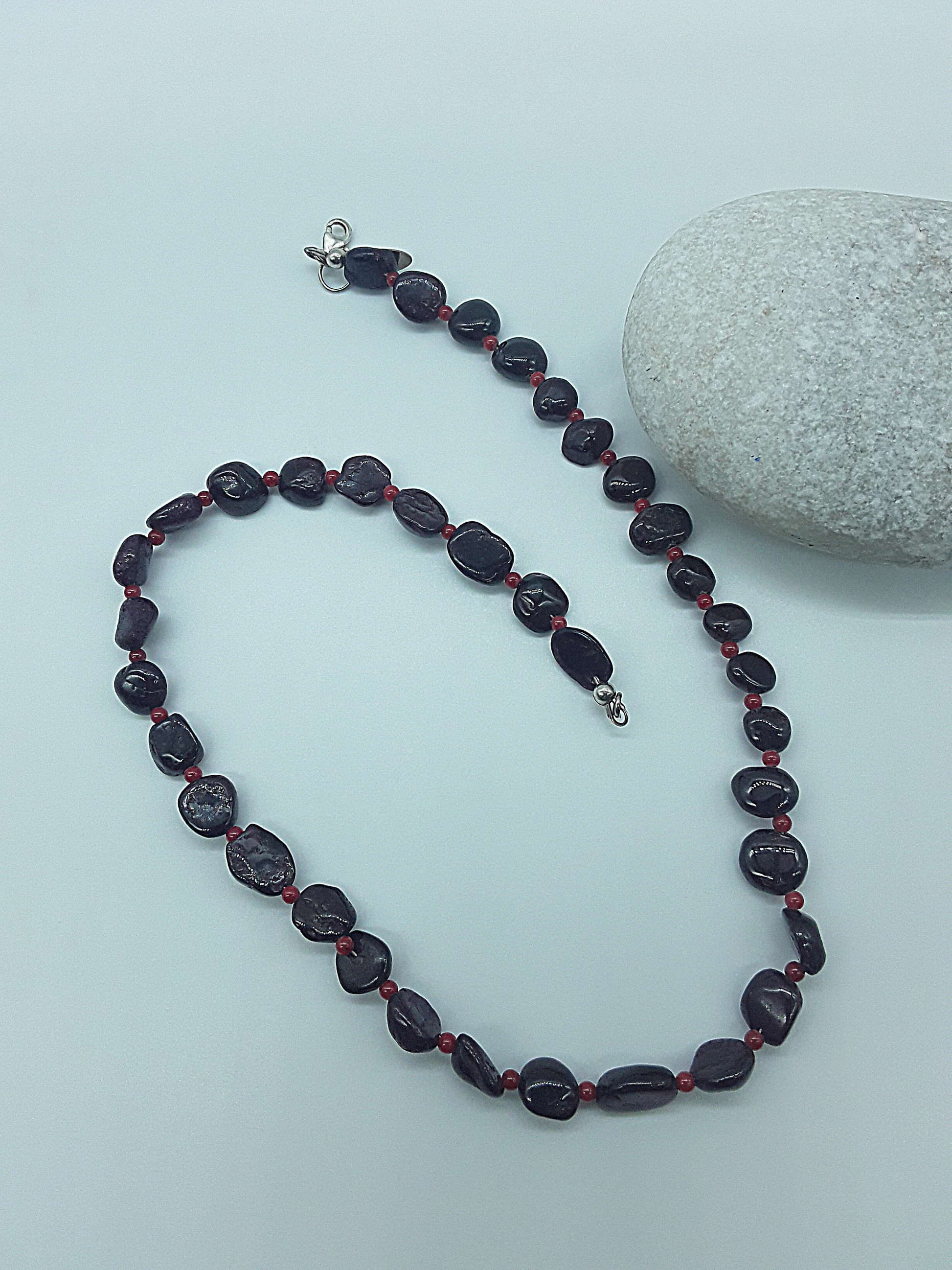 The Crimson Flame Necklace by Polmadeva – garnet and red coral necklace with 925 silver symbolizing courage, resilience, and timeless elegance