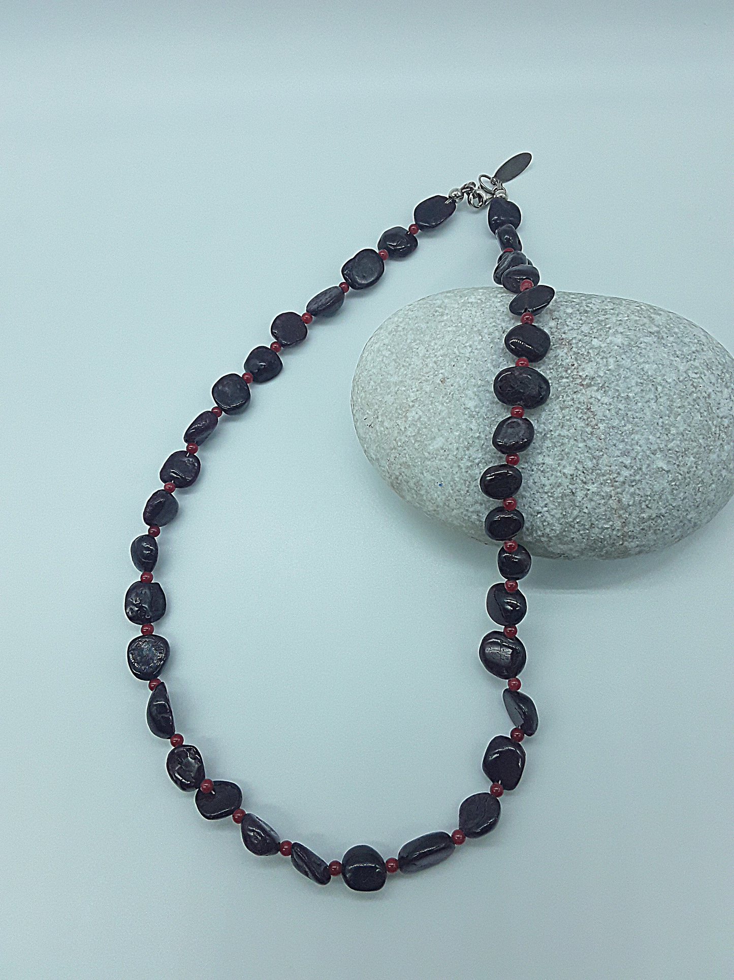 The Crimson Flame Necklace by Polmadeva – garnet and red coral necklace with 925 silver symbolizing courage, resilience, and timeless elegance