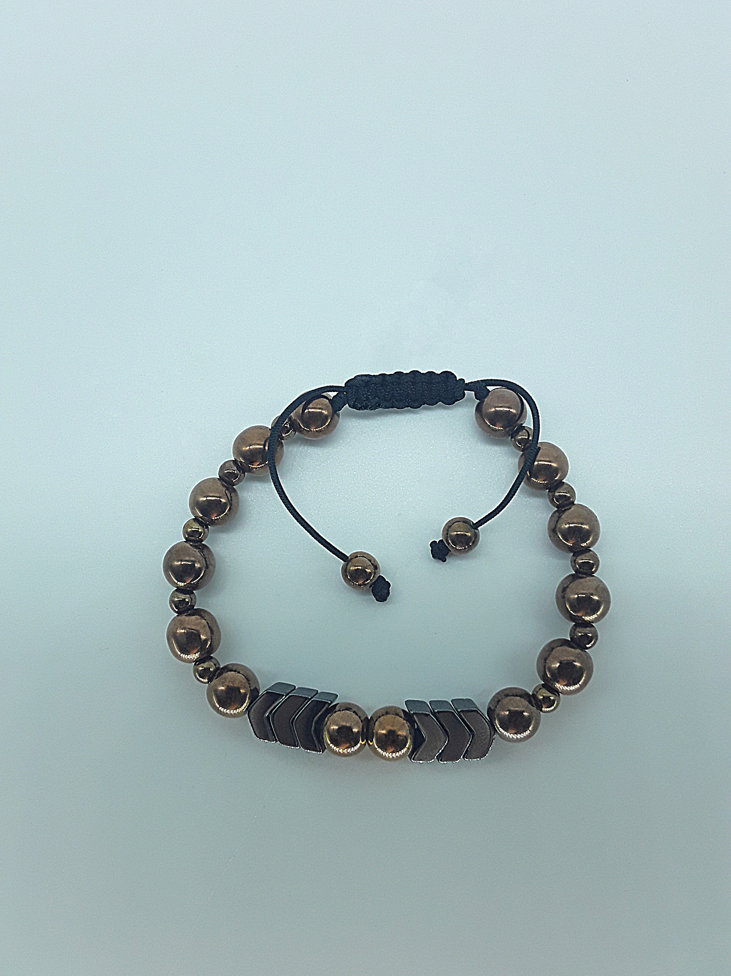 The Arrow of Equilibrium Bracelet by Polmadeva – black onyx and hematite bracelet with arrow accents symbolizing balance, focus, and quiet strength