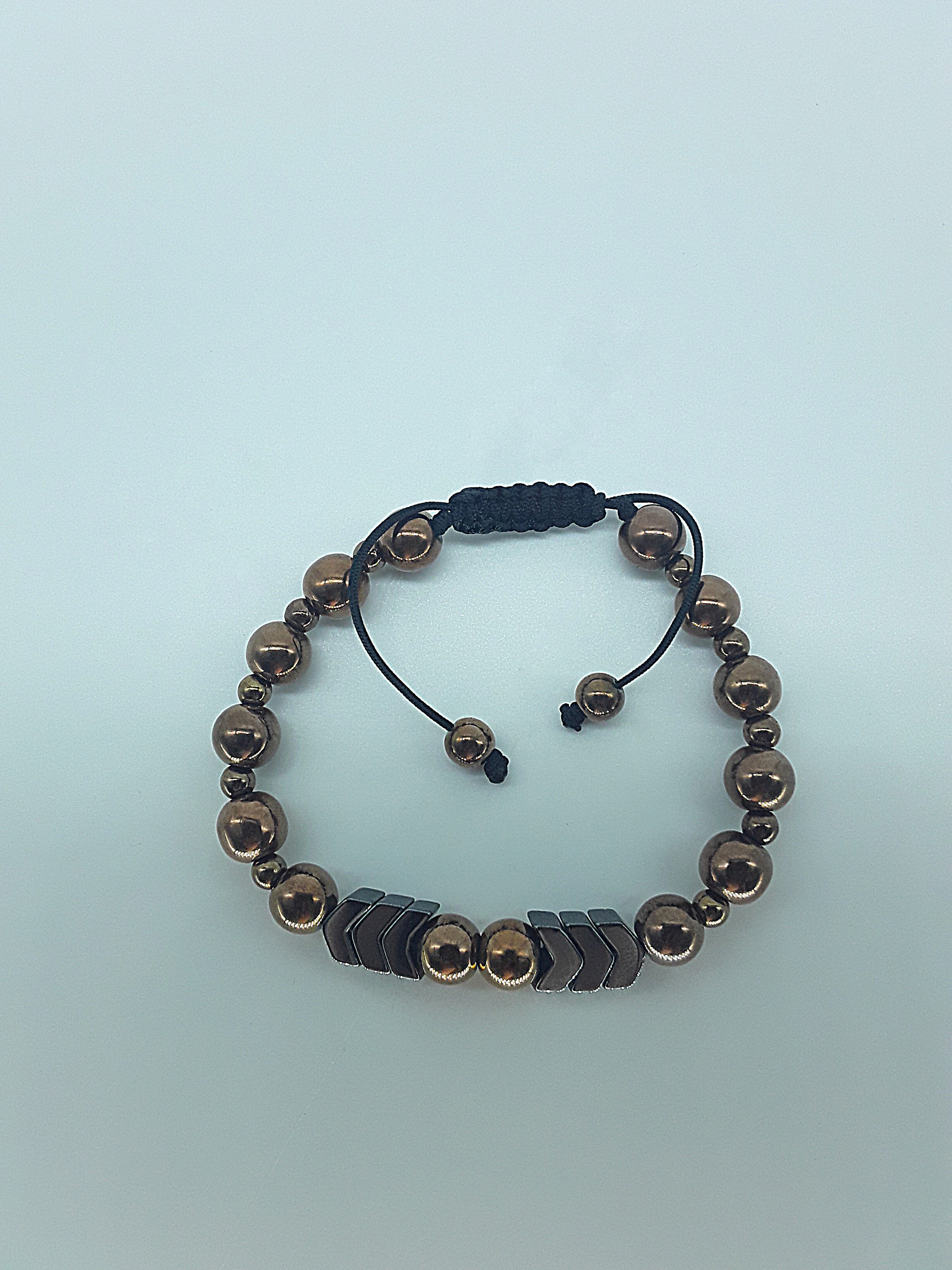 The Arrow of Equilibrium Bracelet by Polmadeva – black onyx and hematite bracelet with arrow accents symbolizing balance, focus, and quiet strength
