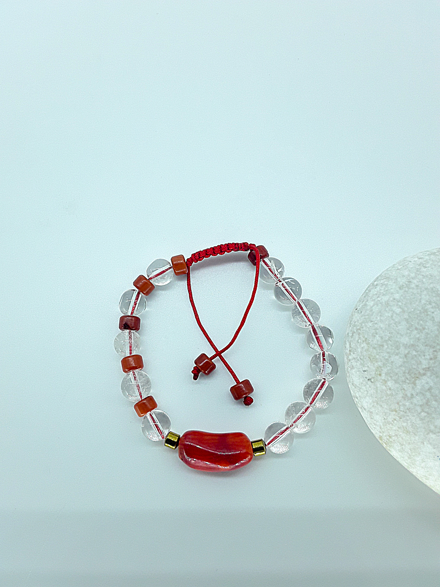 The Flameheart Bracelet by Polmadeva – red coral, quartz crystal and hematite bracelet symbolizing courage, strength, and determination