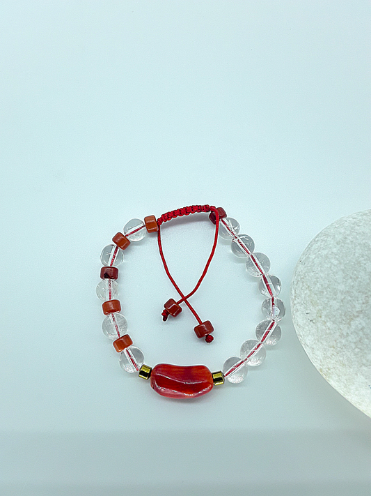 The Flameheart Bracelet by Polmadeva – red coral, quartz crystal and hematite bracelet symbolizing courage, strength, and determination