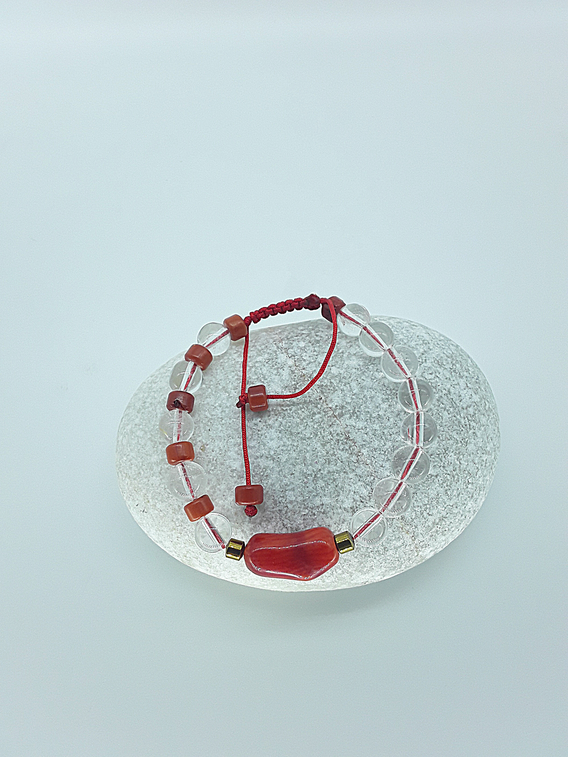 The Flameheart Bracelet by Polmadeva – red coral, quartz crystal and hematite bracelet symbolizing courage, strength, and determination