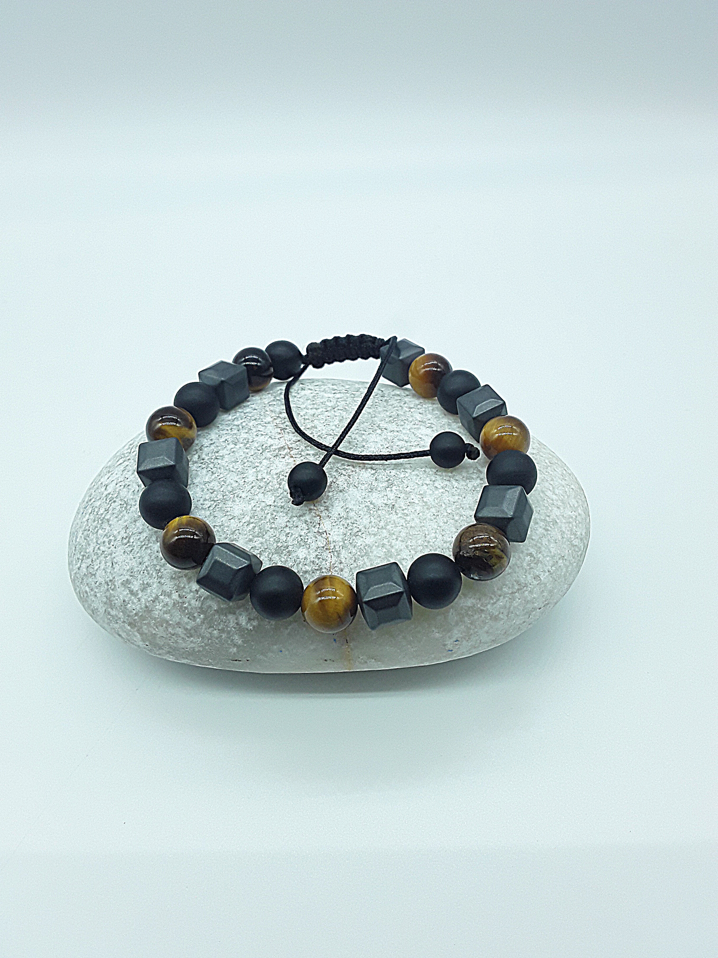 The Resolute Bracelet by Polmadeva – black onyx, hematite and tiger eye bracelet symbolizing courage, balance, and quiet strength