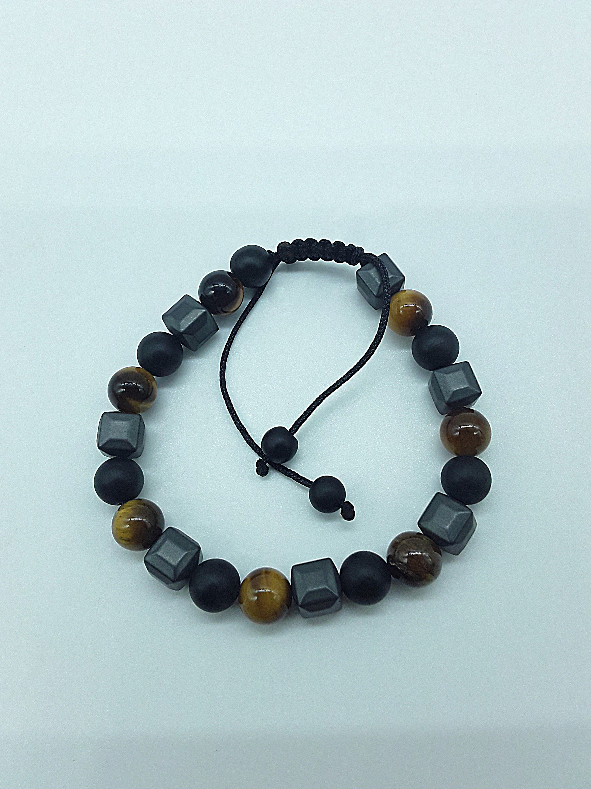 The Resolute Bracelet by Polmadeva – black onyx, hematite and tiger eye bracelet symbolizing courage, balance, and quiet strength