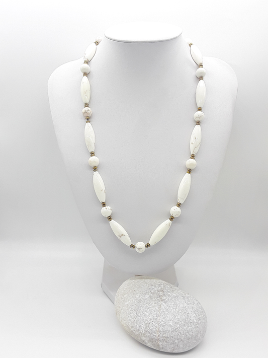 The Ivory Dawn Necklace by Polmadeva – Turquoise and Hematite necklace symbolizing purity, balance, and renewal with gold clasp.