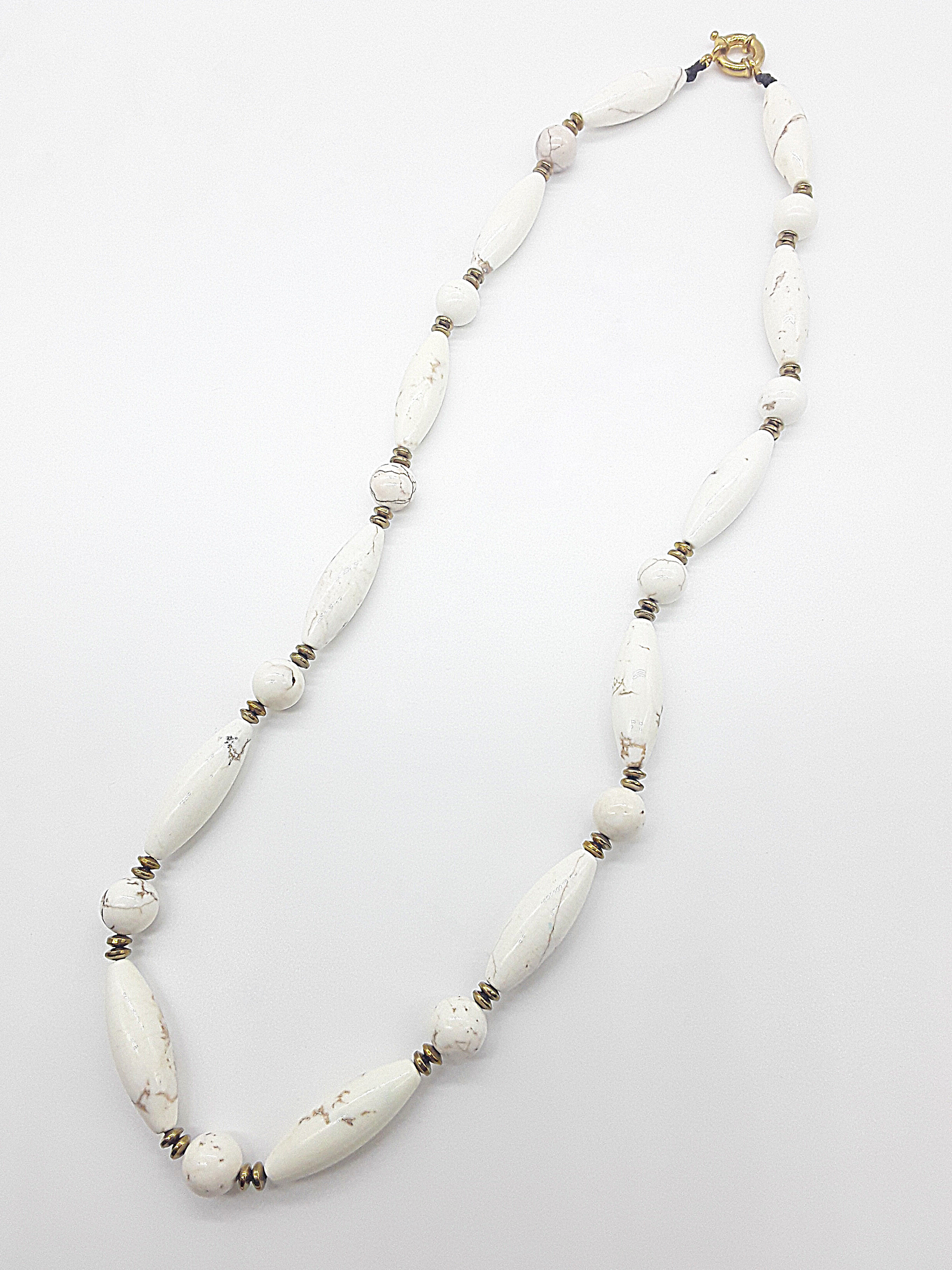 The Ivory Dawn Necklace by Polmadeva – Turquoise and Hematite necklace symbolizing purity, balance, and renewal with gold clasp.