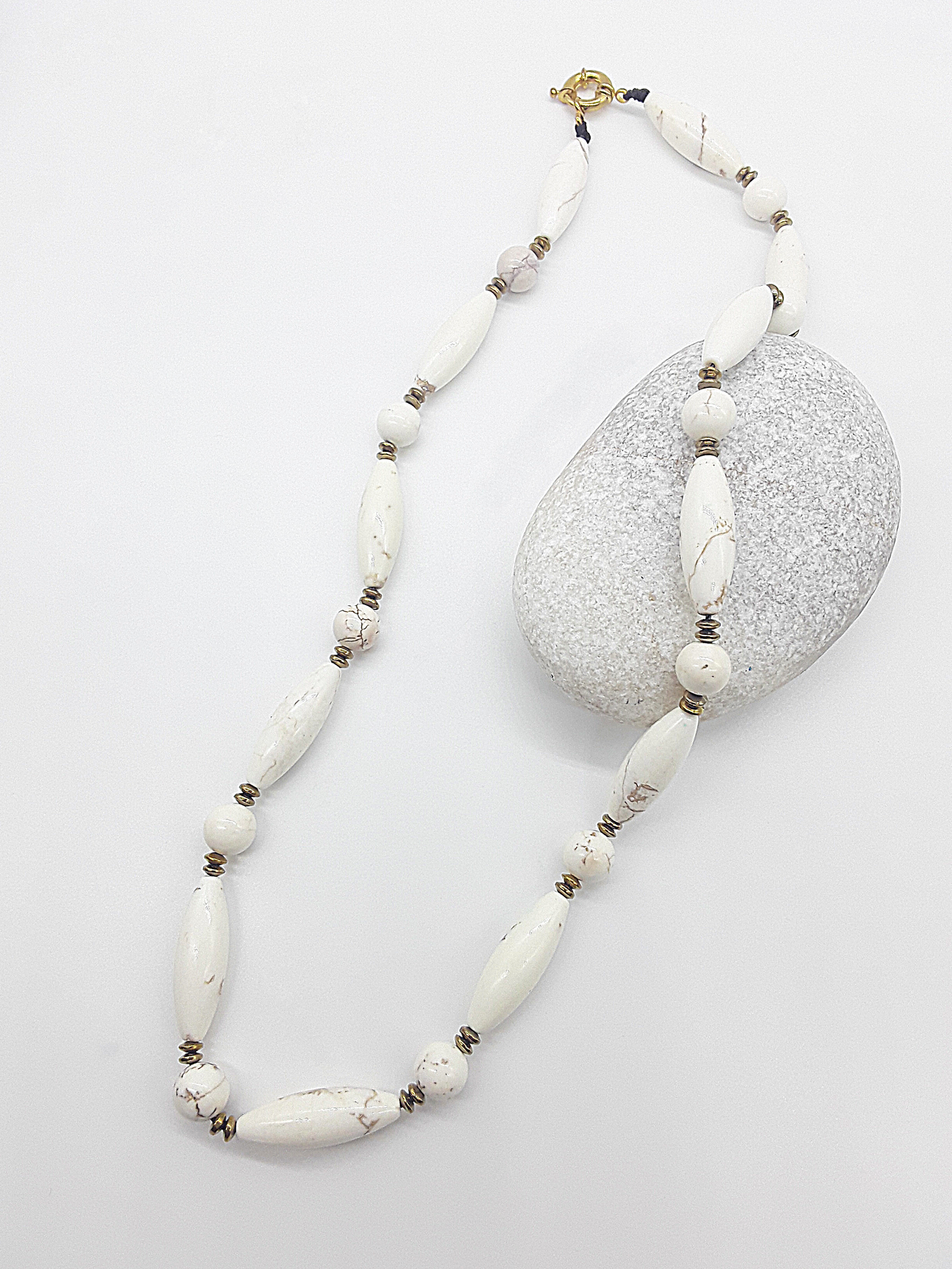 The Ivory Dawn Necklace by Polmadeva – Turquoise and Hematite necklace symbolizing purity, balance, and renewal with gold clasp.