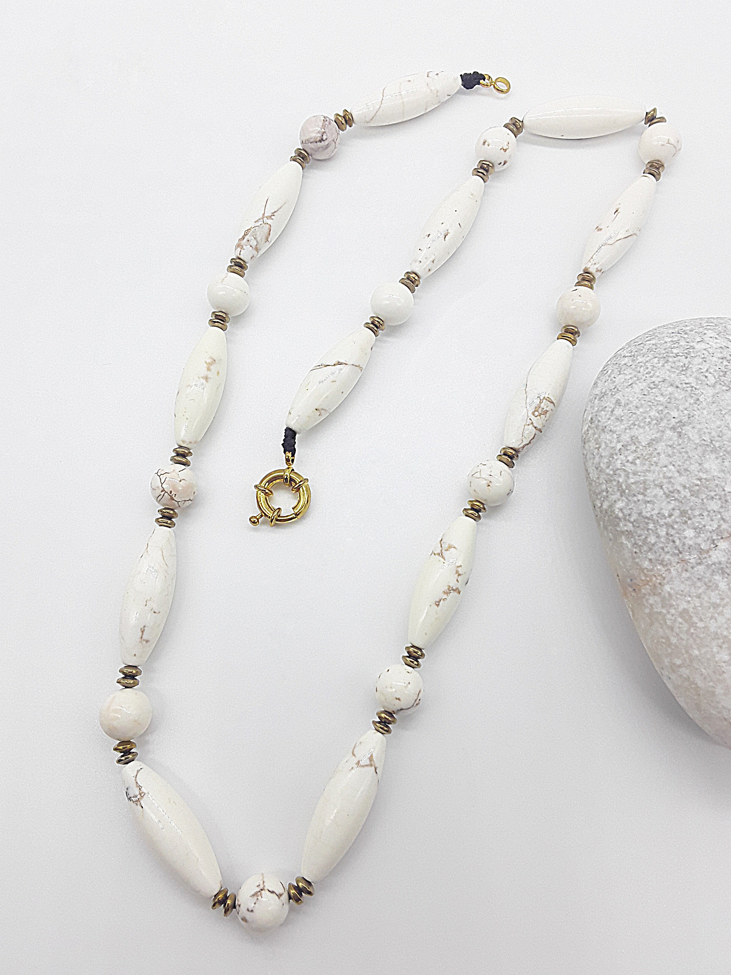 The Ivory Dawn Necklace by Polmadeva – Turquoise and Hematite necklace symbolizing purity, balance, and renewal with gold clasp.