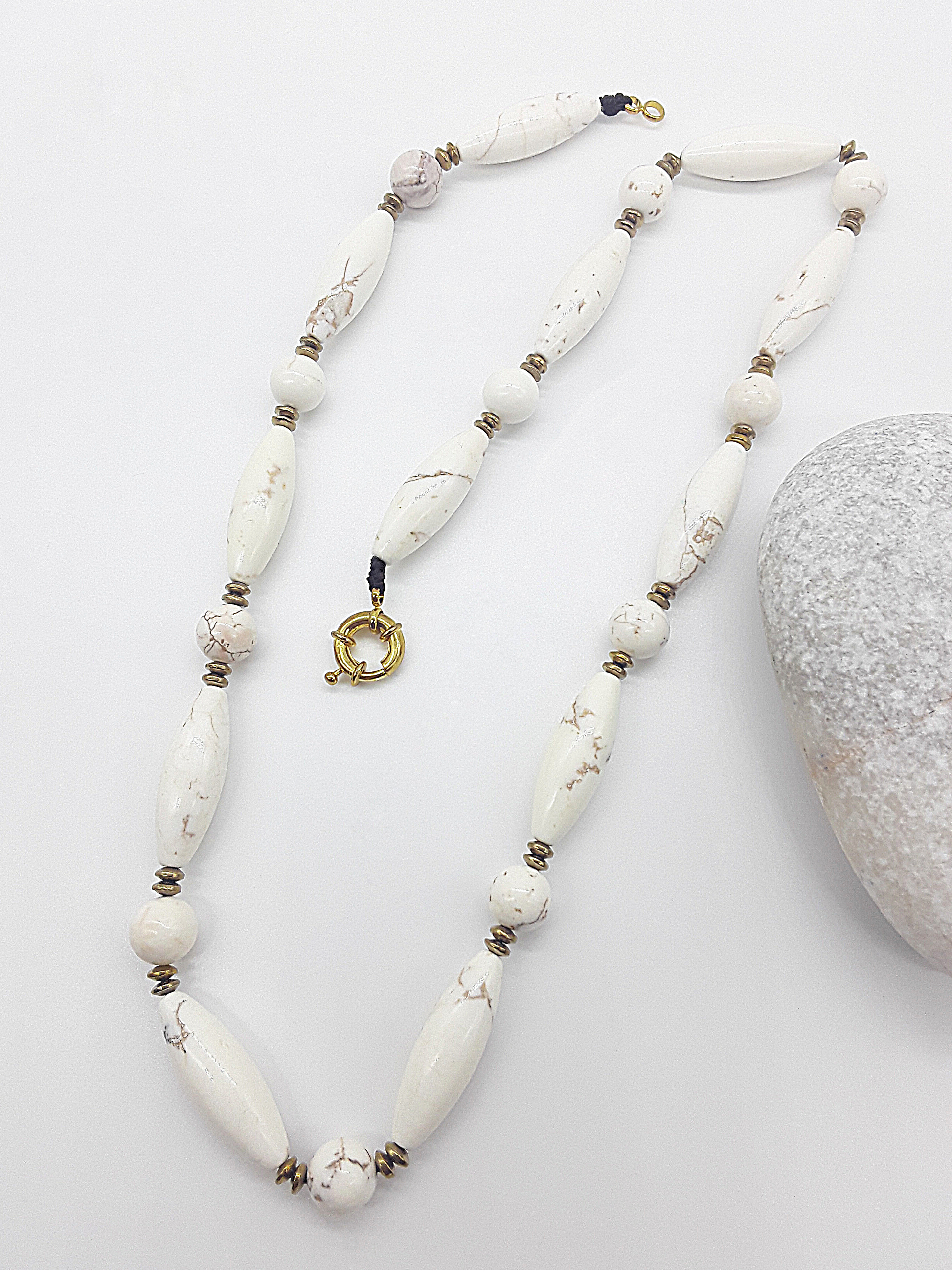 The Ivory Dawn Necklace by Polmadeva – Turquoise and Hematite necklace symbolizing purity, balance, and renewal with gold clasp.