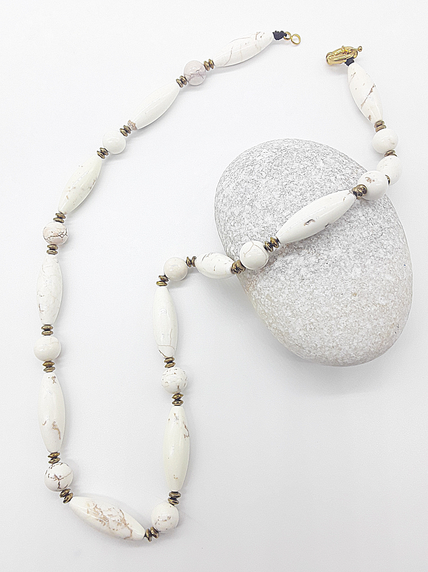 The Ivory Dawn Necklace by Polmadeva – Turquoise and Hematite necklace symbolizing purity, balance, and renewal with gold clasp.