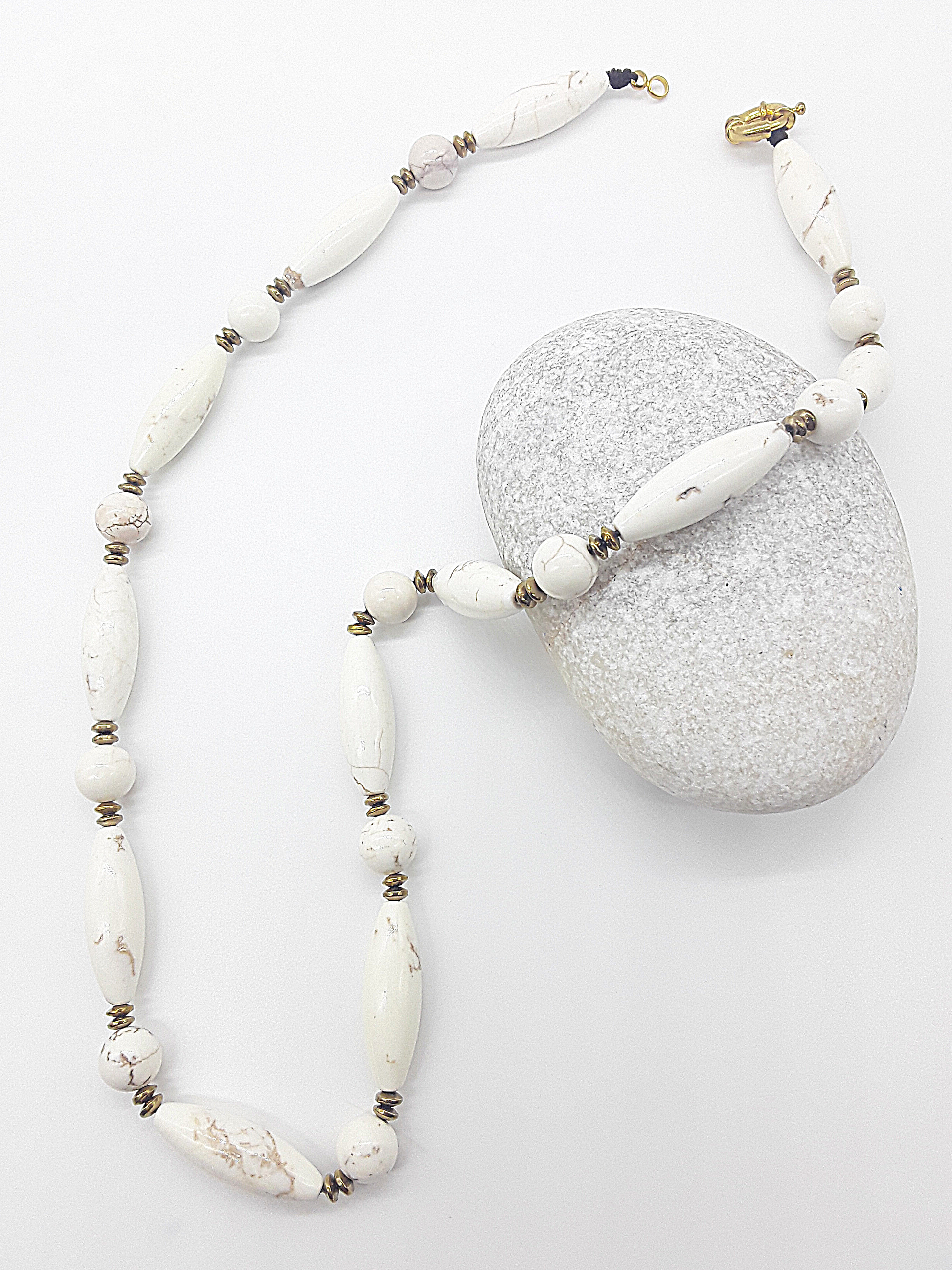 The Ivory Dawn Necklace by Polmadeva – Turquoise and Hematite necklace symbolizing purity, balance, and renewal with gold clasp.