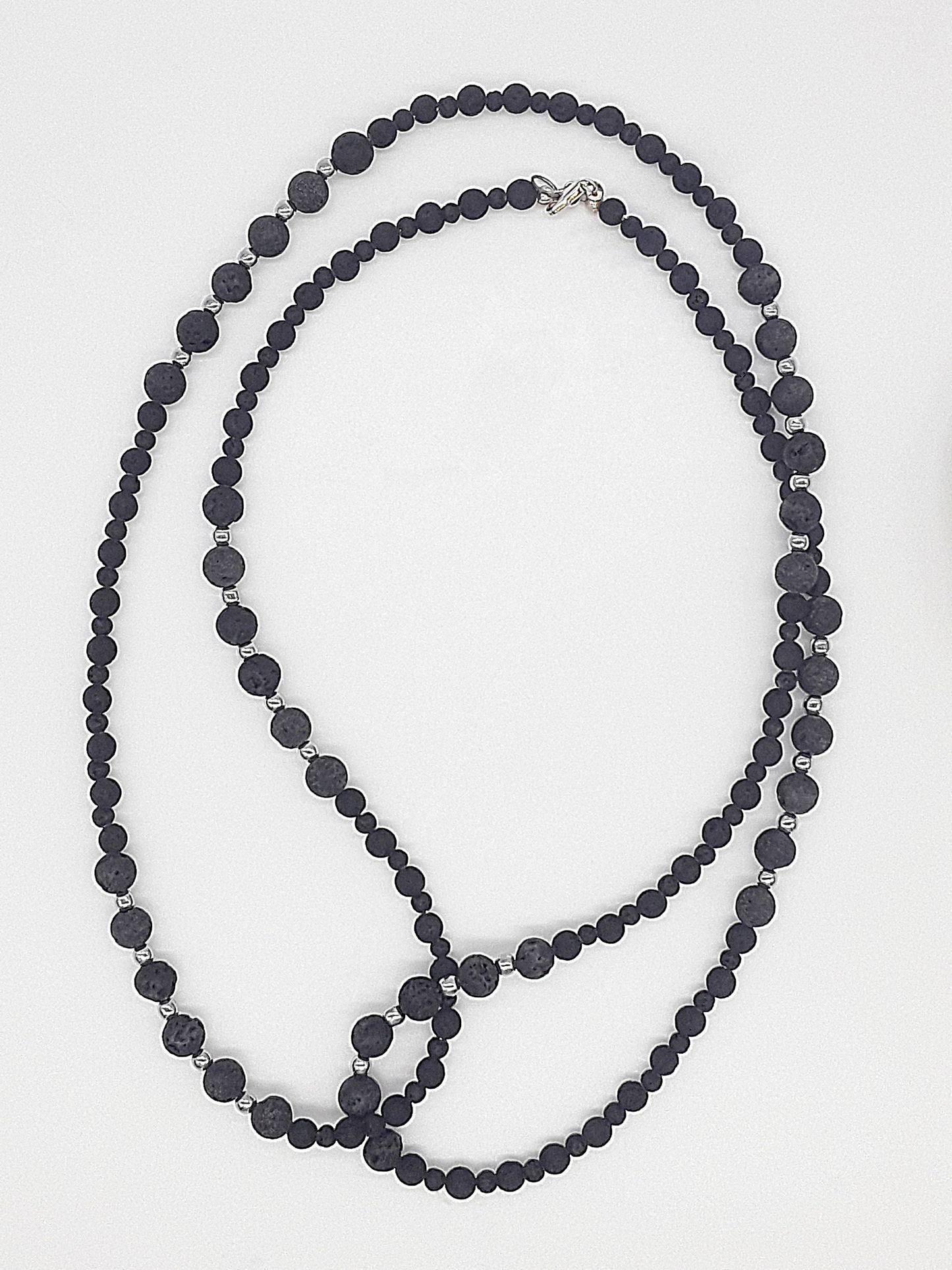 The Nocturne Strand Necklace by Polmadeva – lava stone, hematite and 925 silver necklace symbolizing quiet strength, elegance, and resilience
