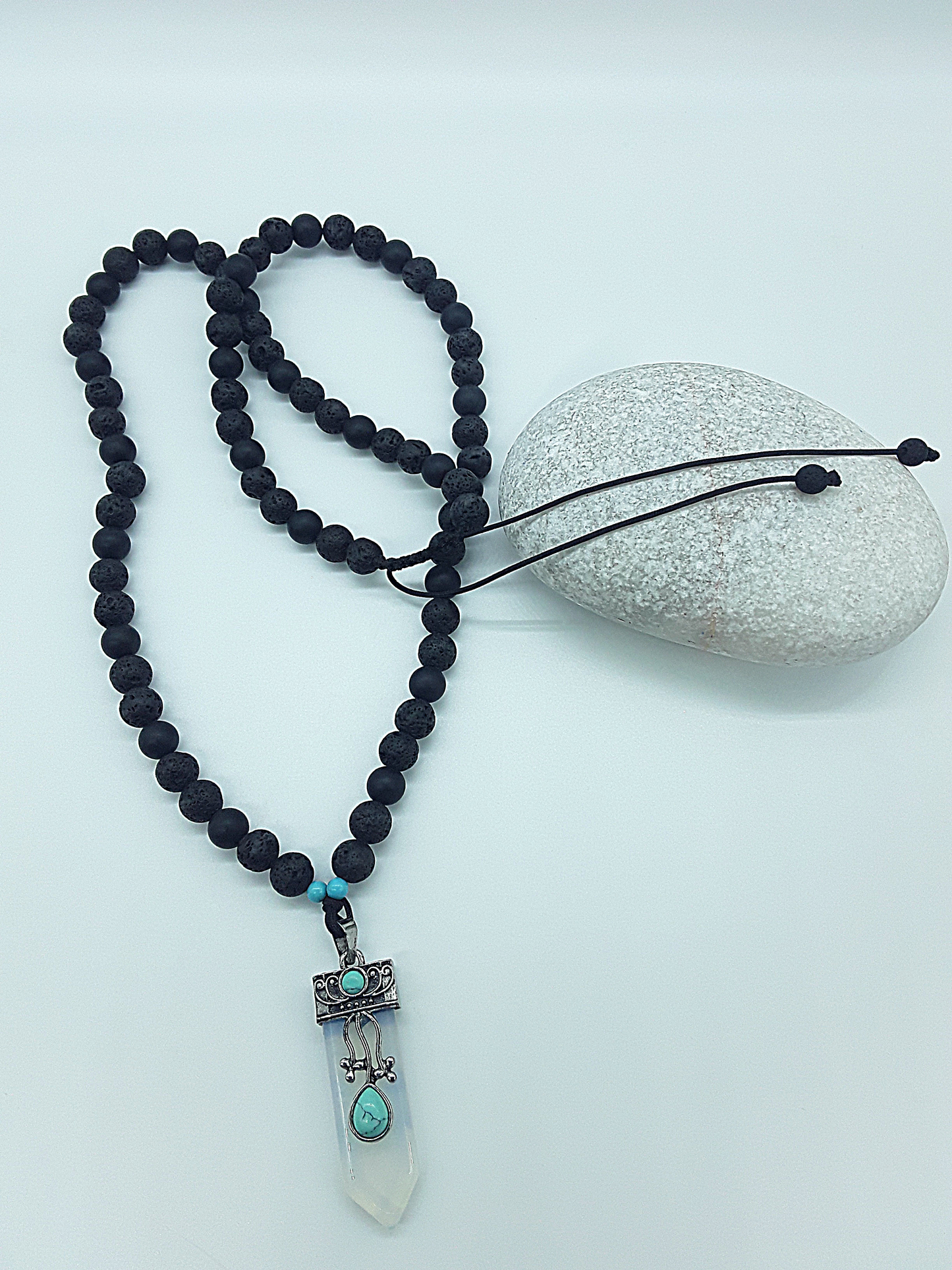 The Phoenix Opalite Necklace by Polmadeva – black onyx, lava stone and turquoise necklace with silver opalite pendant symbolizing rebirth and renewal