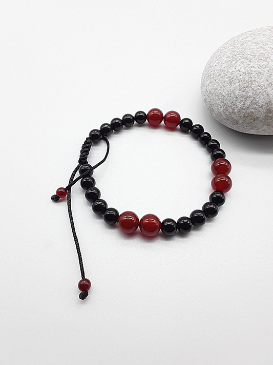 The Vital Pulse Bracelet by Polmadeva – carnelian and black onyx bracelet symbolizing vitality, balance, and quiet strength