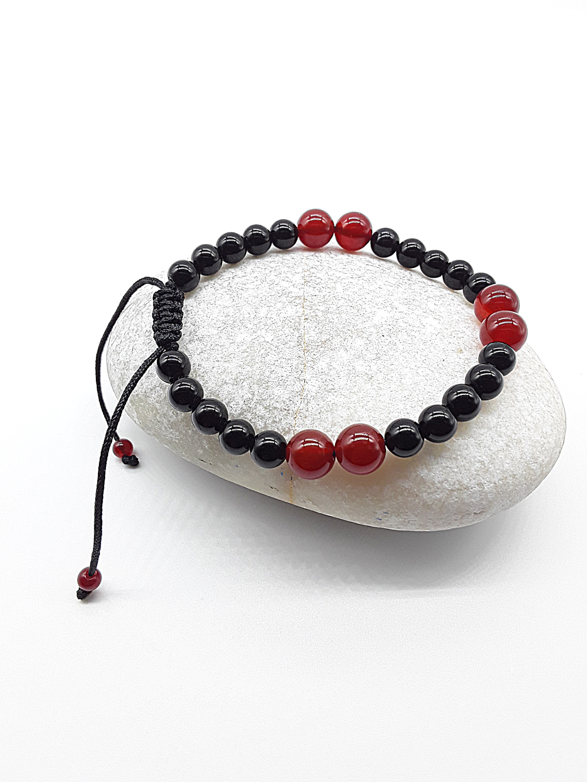The Vital Pulse Bracelet by Polmadeva – carnelian and black onyx bracelet symbolizing vitality, balance, and quiet strength
