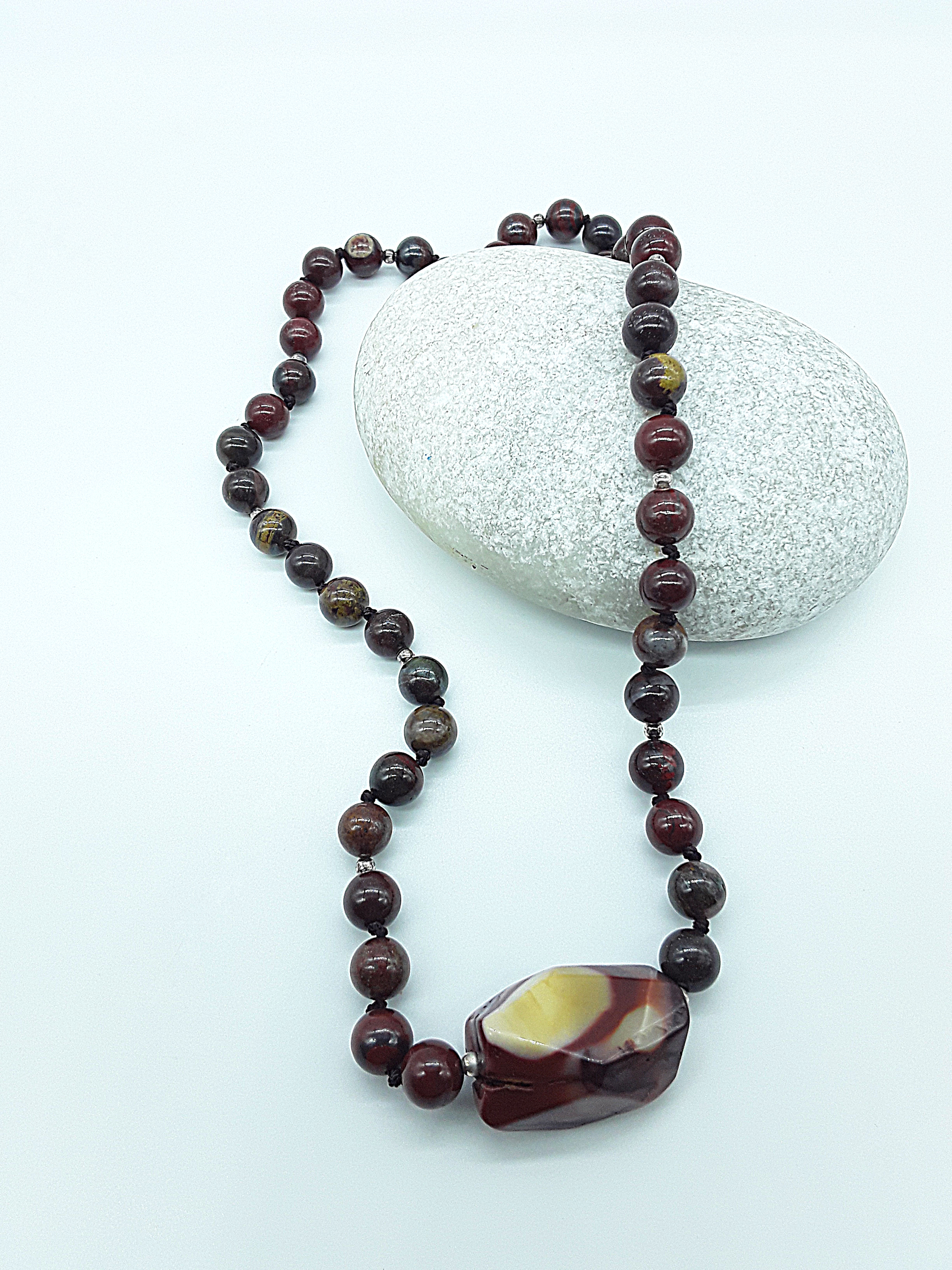 The Iron Flame Necklace by Polmadeva – Red Tiger Iron & Agate necklace symbolizing strength, resilience, and balance born in fire.