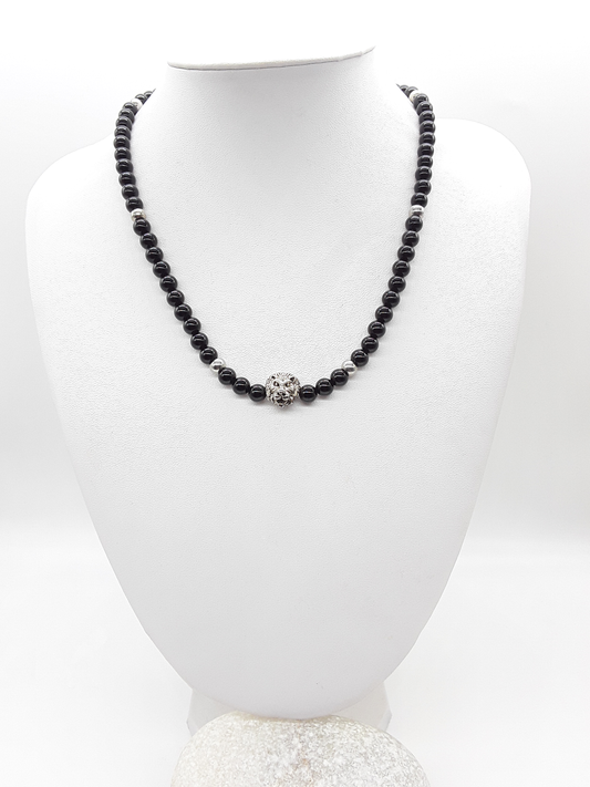 The Lionheart Guardian Necklace by Polmadeva – black onyx, 925 silver and stainless steel necklace with lion pendant symbolizing strength and protection