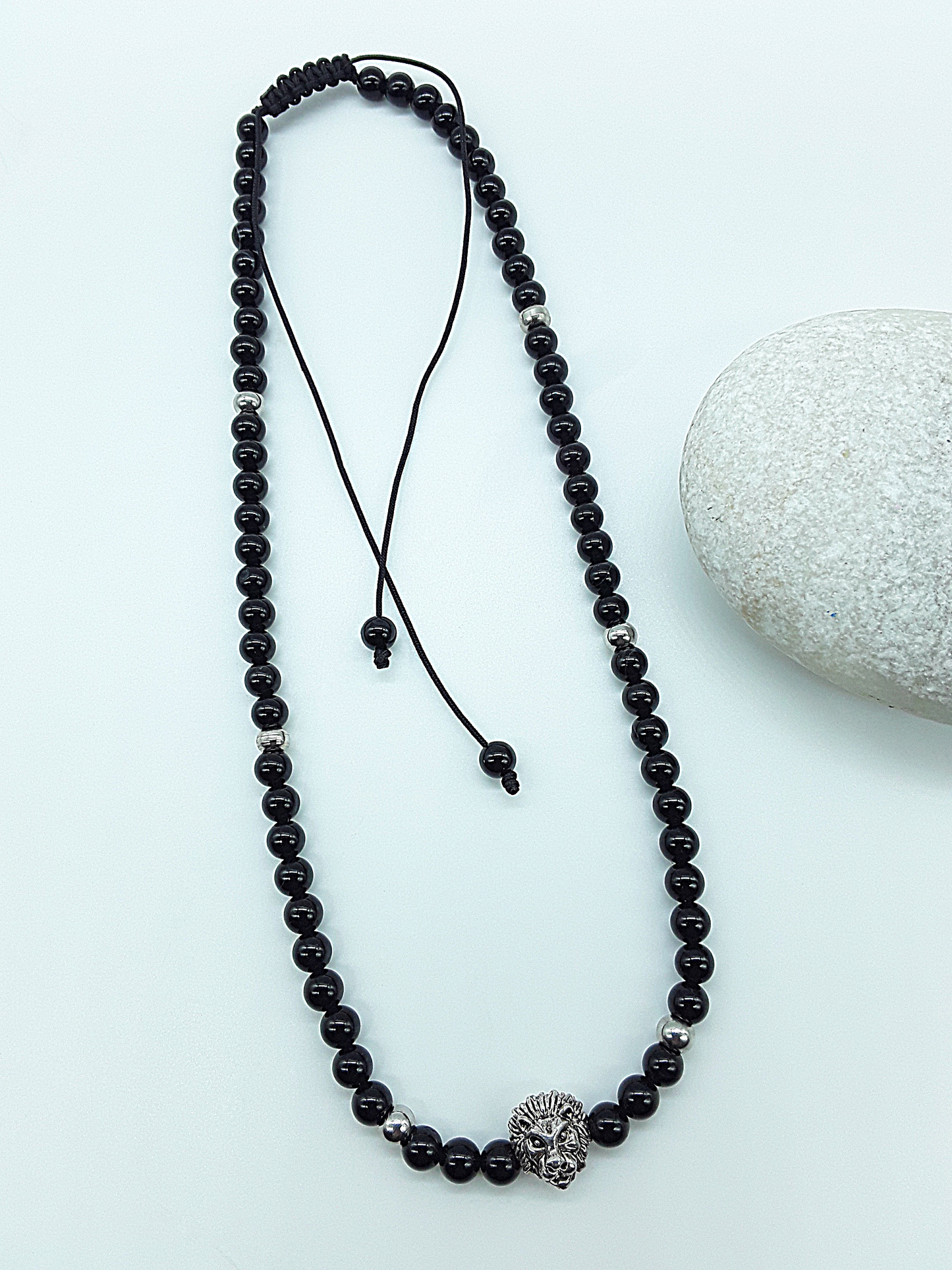 The Lionheart Guardian Necklace by Polmadeva – black onyx, 925 silver and stainless steel necklace with lion pendant symbolizing strength and protection