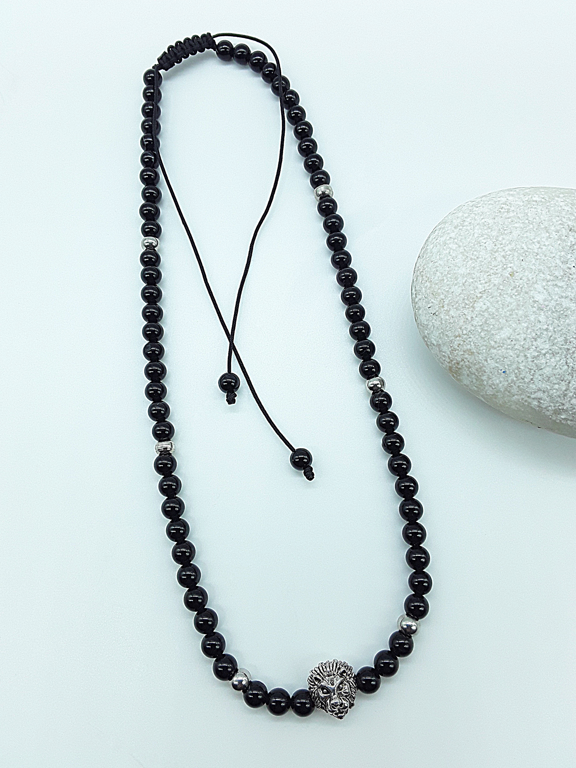 The Lionheart Guardian Necklace by Polmadeva – black onyx, 925 silver and stainless steel necklace with lion pendant symbolizing strength and protection