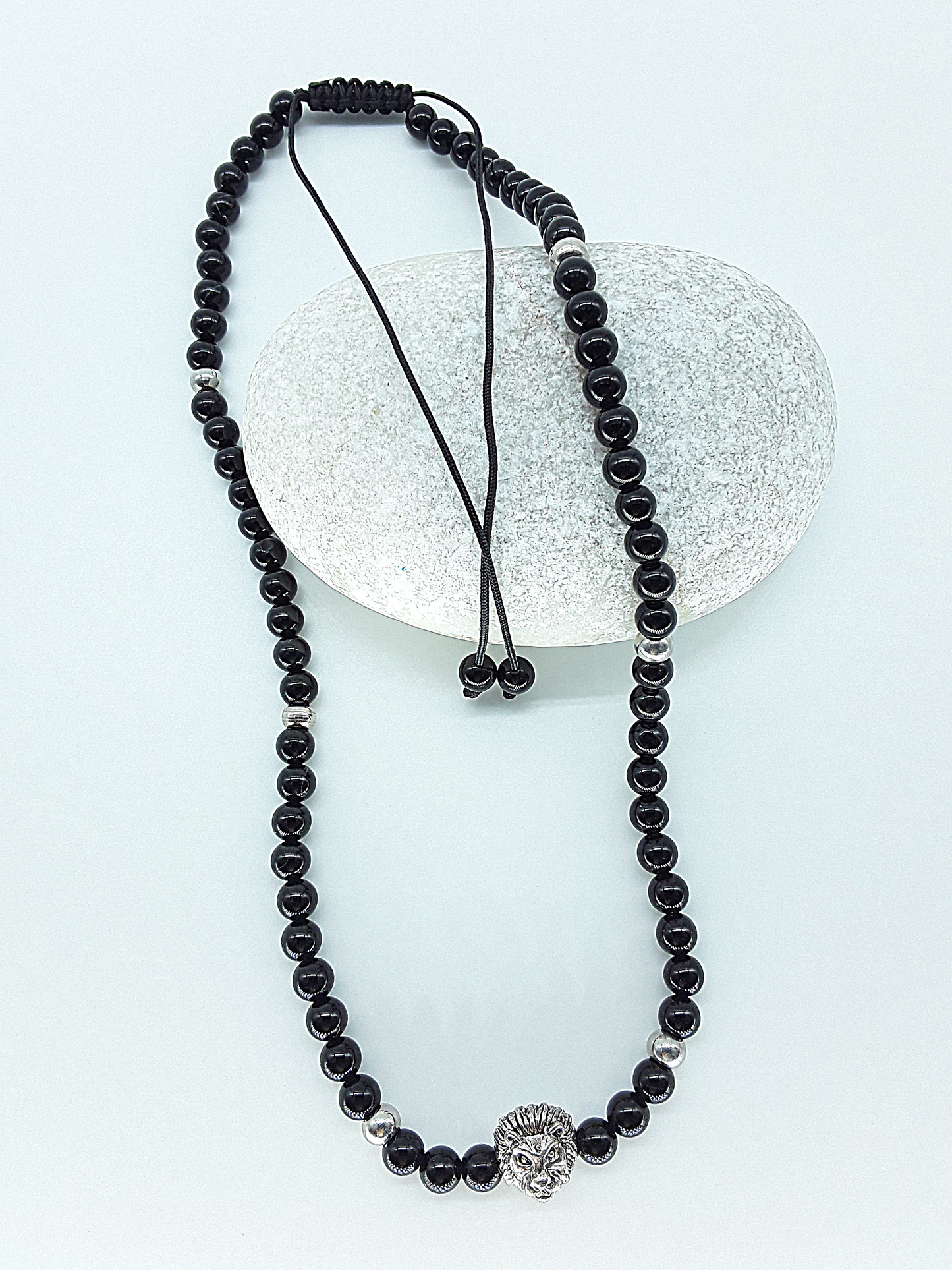 The Lionheart Guardian Necklace by Polmadeva – black onyx, 925 silver and stainless steel necklace with lion pendant symbolizing strength and protection