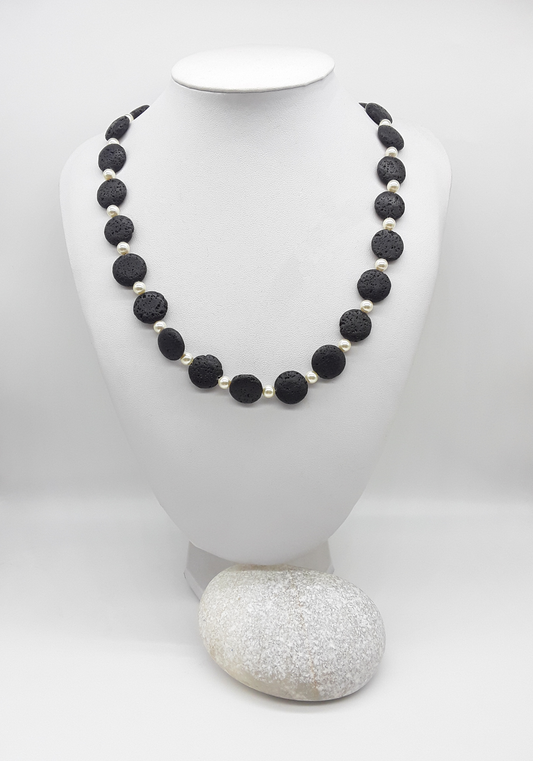 The Eclipse Necklace by Polmadeva – black lava stone and Swarovski pearl necklace with 925 silver symbolizing duality, strength, and elegance