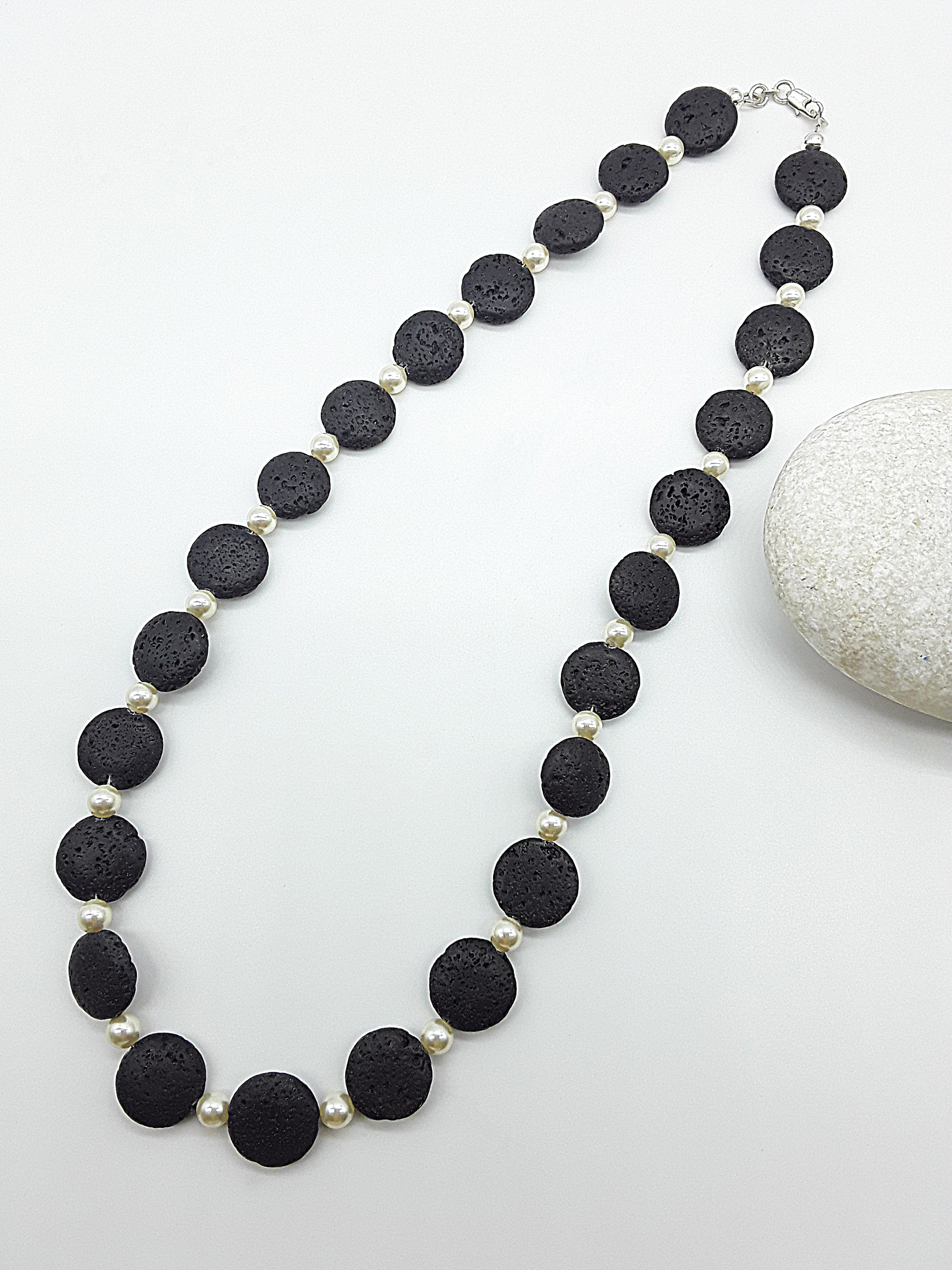 The Eclipse Necklace by Polmadeva – black lava stone and Swarovski pearl necklace with 925 silver symbolizing duality, strength, and elegance
