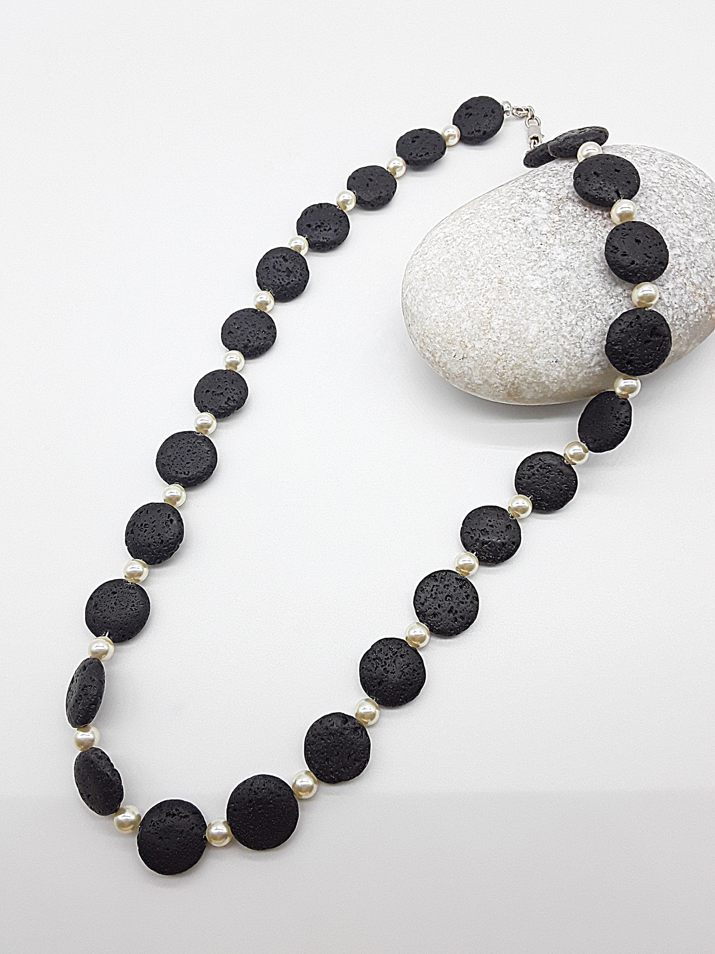 The Eclipse Necklace by Polmadeva – black lava stone and Swarovski pearl necklace with 925 silver symbolizing duality, strength, and elegance