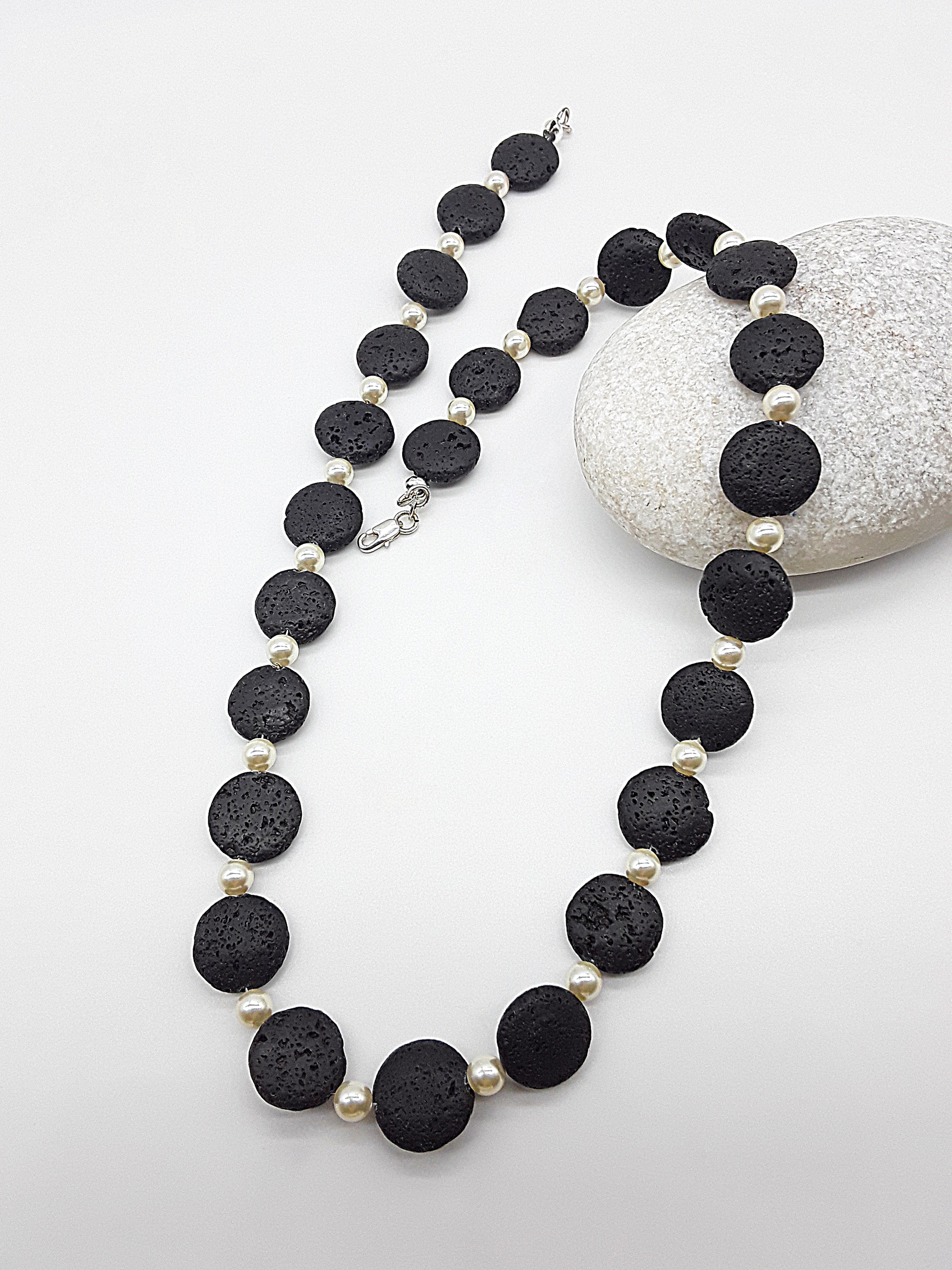The Eclipse Necklace by Polmadeva – black lava stone and Swarovski pearl necklace with 925 silver symbolizing duality, strength, and elegance