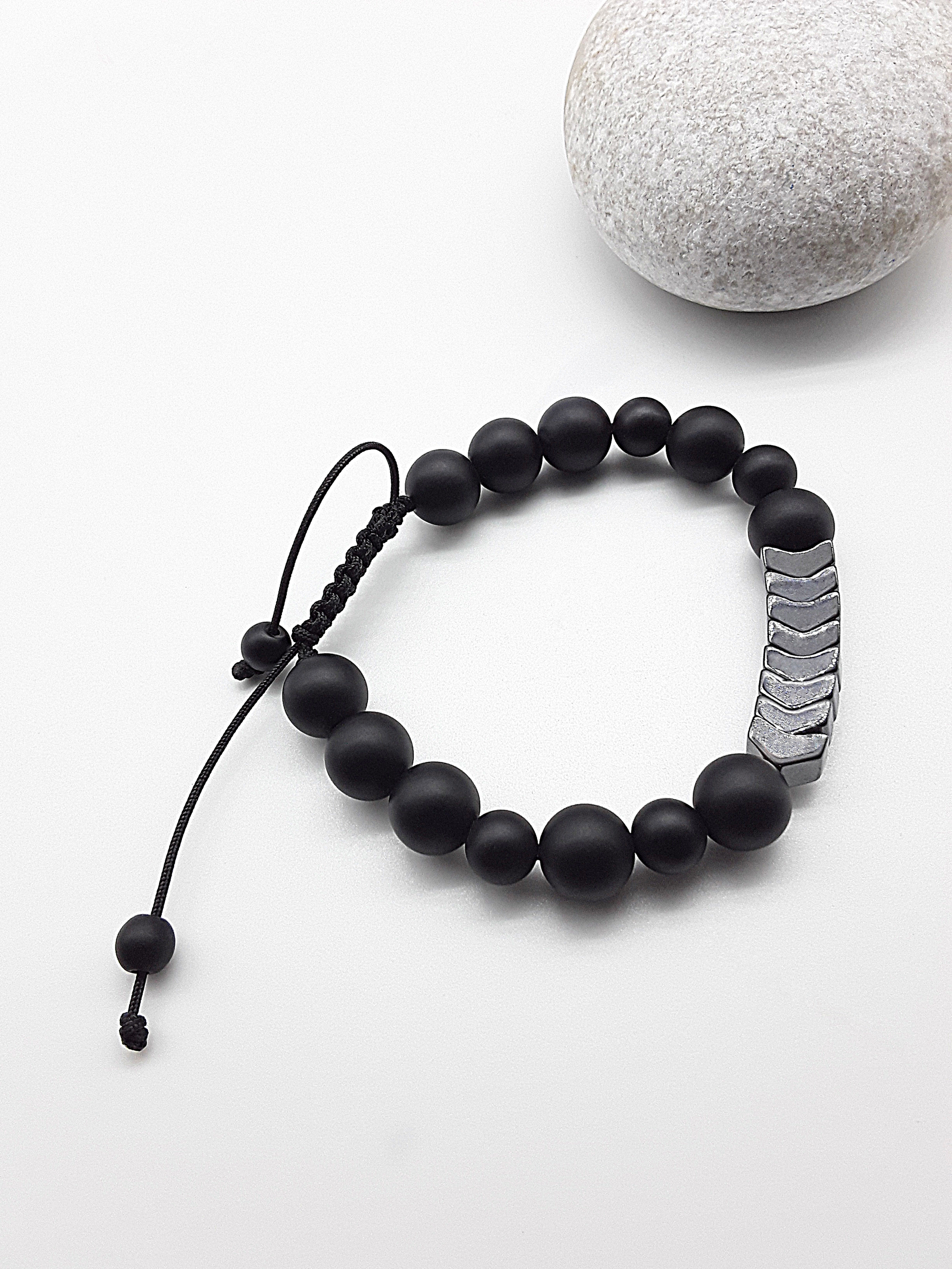 The Silent Arrow Bracelet by Polmadeva – black onyx and hematite bracelet with silver arrow accents symbolizing balance, focus, and quiet strength