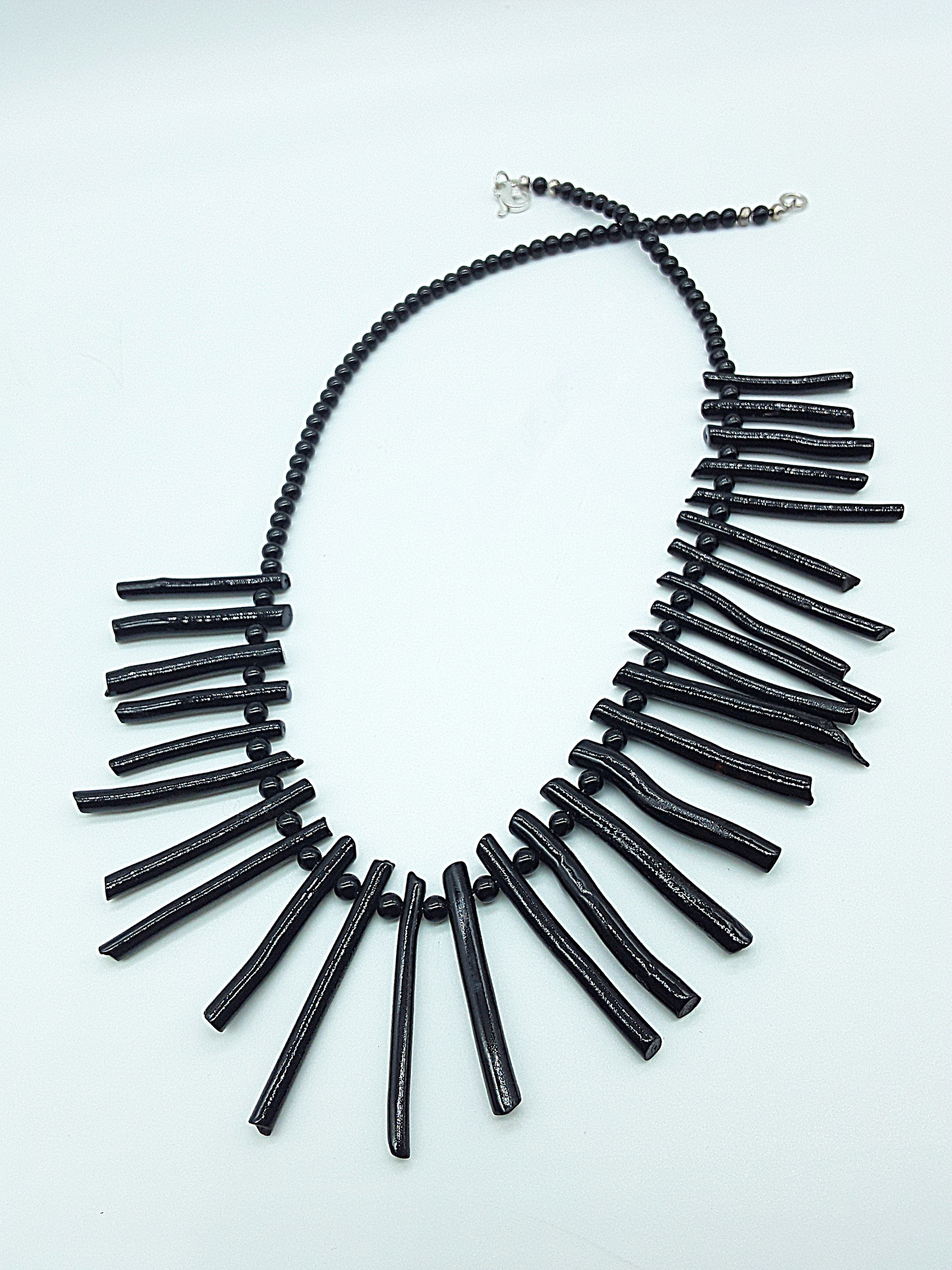 The Obsidian Coral Necklace by Polmadeva – black coral and 925 silver necklace symbolizing strength, protection, and quiet resilience
