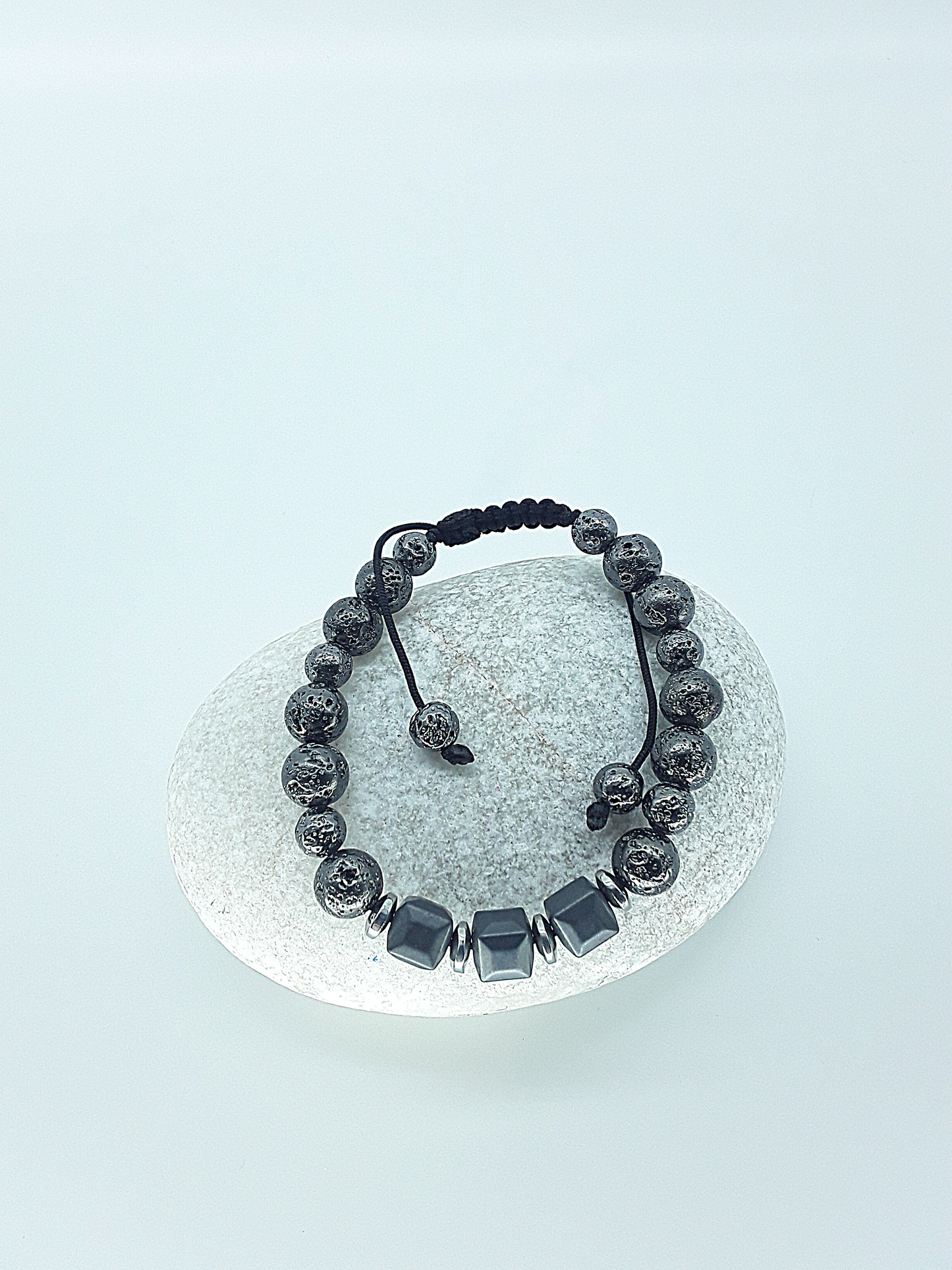 The Guardian’s Aegis Bracelet by Polmadeva – electroplated lava stone and hematite bracelet symbolizing protection, balance, and inner strength