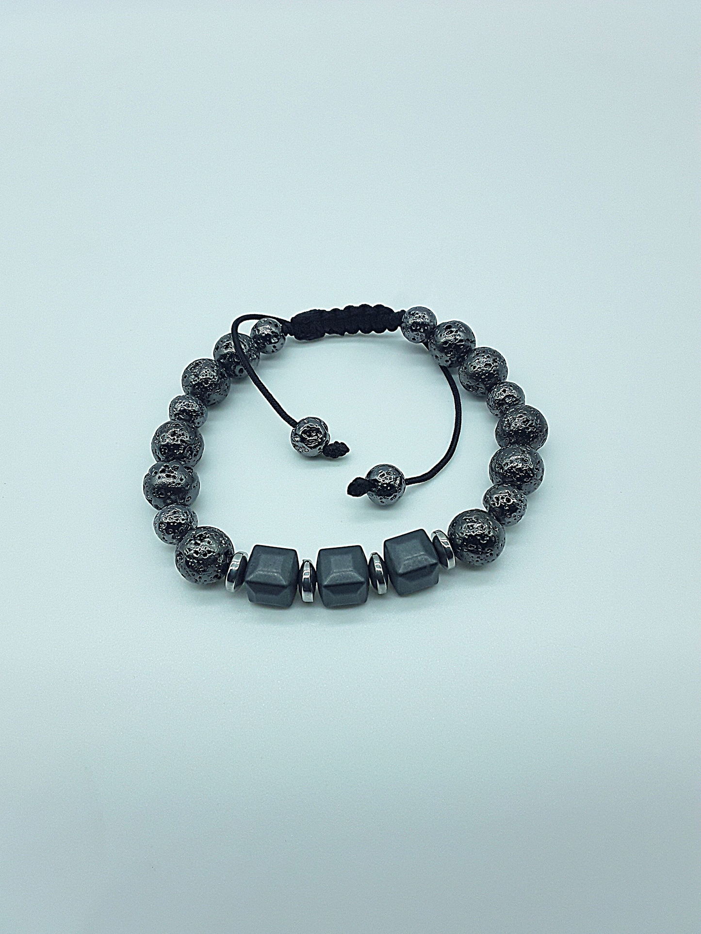 The Guardian’s Aegis Bracelet by Polmadeva – electroplated lava stone and hematite bracelet symbolizing protection, balance, and inner strength