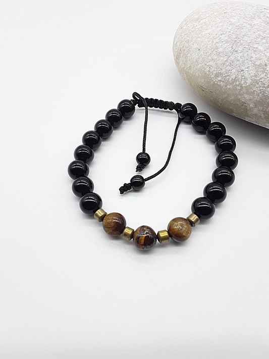 The Sentinel Bracelet by Polmadeva – black onyx, tiger eye and hematite bracelet symbolizing protection, balance, and quiet strength