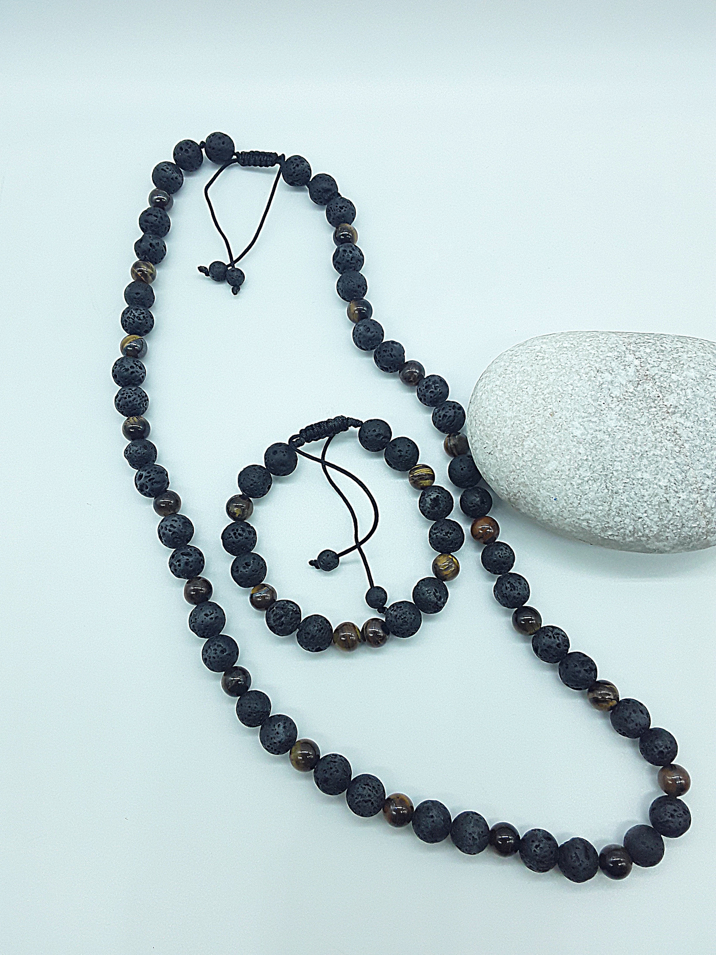 The Earthfire Vision Set by Polmadeva – handcrafted necklace & bracelet with Lava Stones and Tiger’s Eye, symbolizing courage, grounding & inner vision.