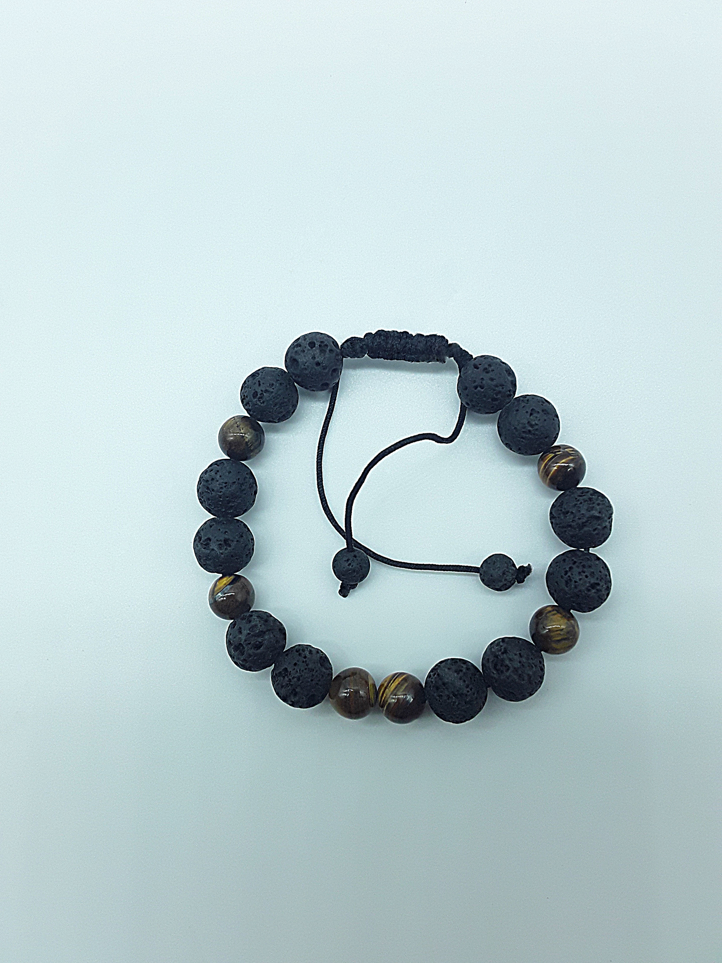 The Earthfire Vision Set by Polmadeva – handcrafted necklace & bracelet with Lava Stones and Tiger’s Eye, symbolizing courage, grounding & inner vision.