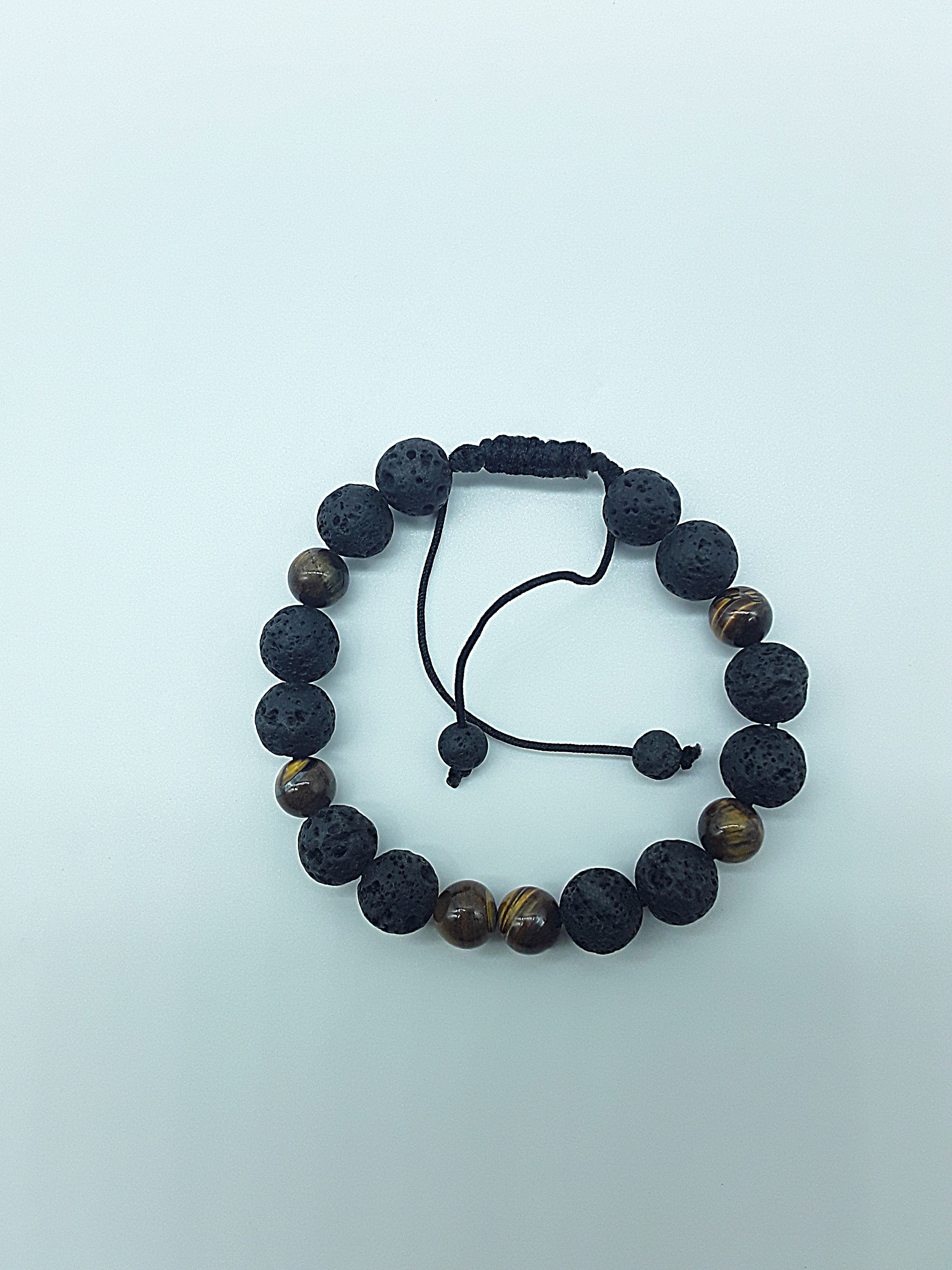The Earthfire Vision Set by Polmadeva – handcrafted necklace & bracelet with Lava Stones and Tiger’s Eye, symbolizing courage, grounding & inner vision.