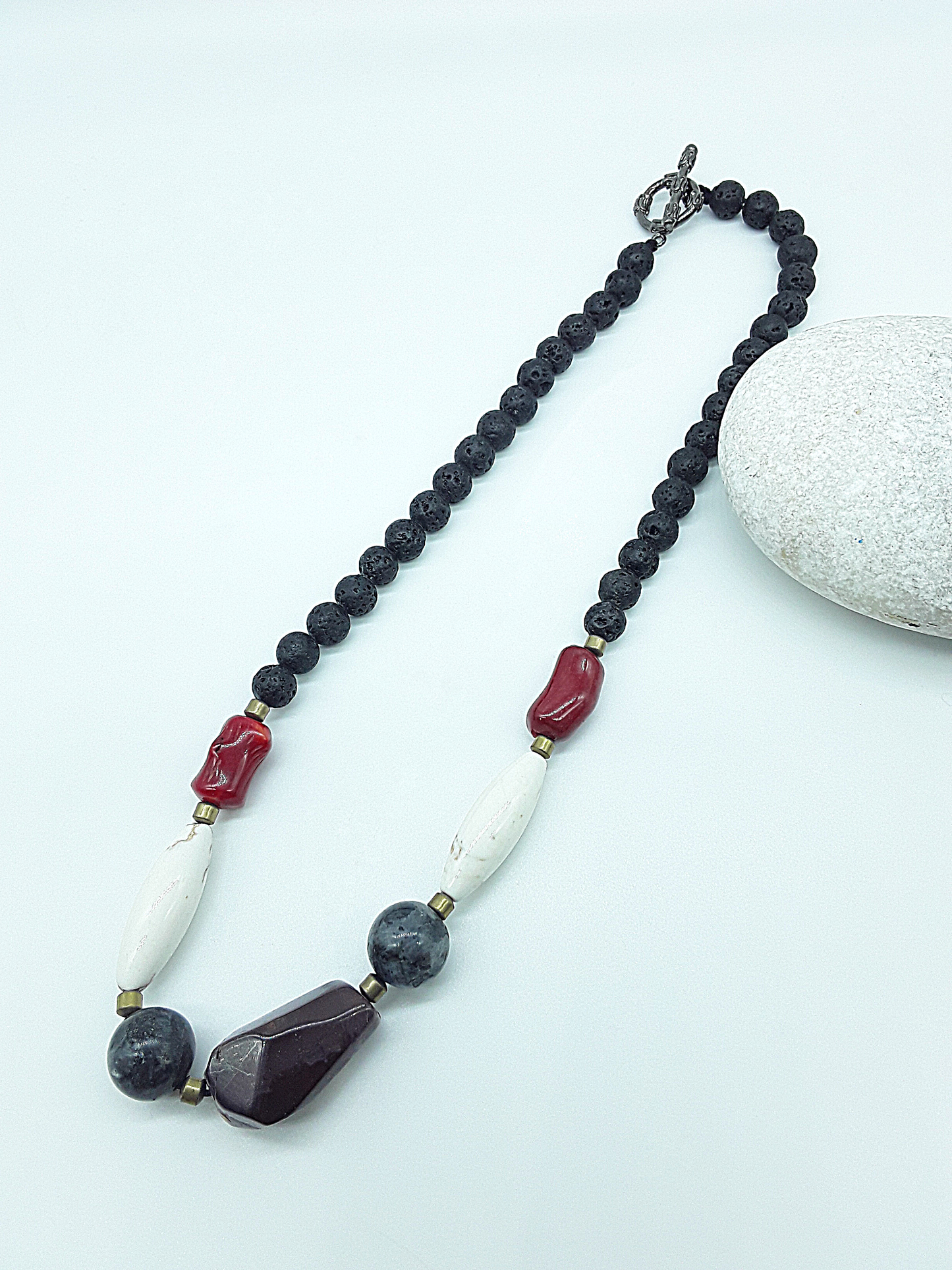 The Flamebound Necklace by Polmadeva – mookaite, lava stone, red coral, turquoise and hematite necklace symbolizing courage, fire, and transformation