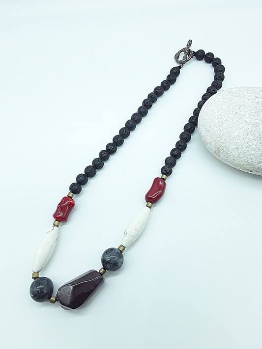 The Flamebound Necklace by Polmadeva – mookaite, lava stone, red coral, turquoise and hematite necklace symbolizing courage, fire, and transformation