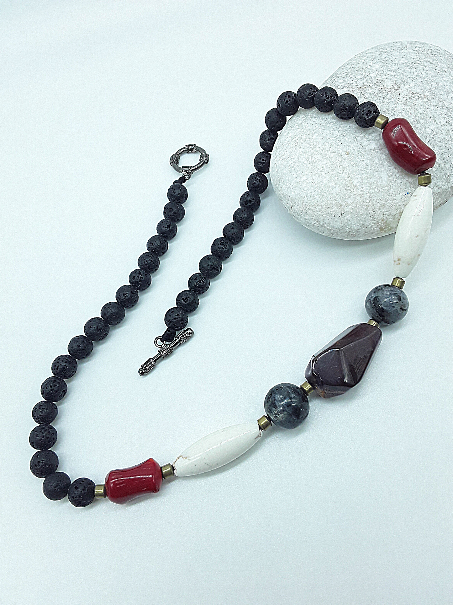 The Flamebound Necklace by Polmadeva – mookaite, lava stone, red coral, turquoise and hematite necklace symbolizing courage, fire, and transformation