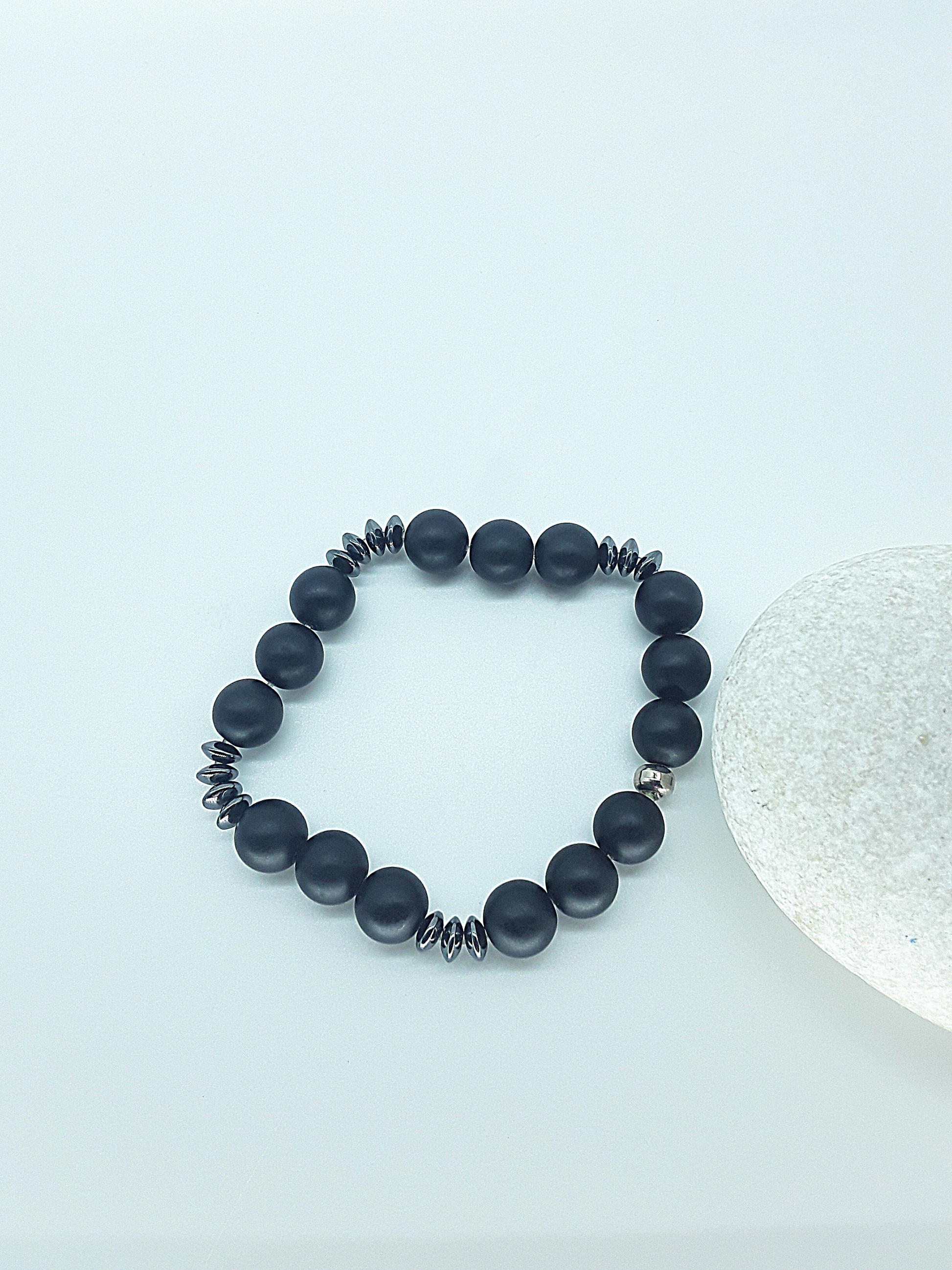 The Fortis Bracelet by Polmadeva – black onyx and hematite bracelet symbolizing strength, grounding, and inner protection