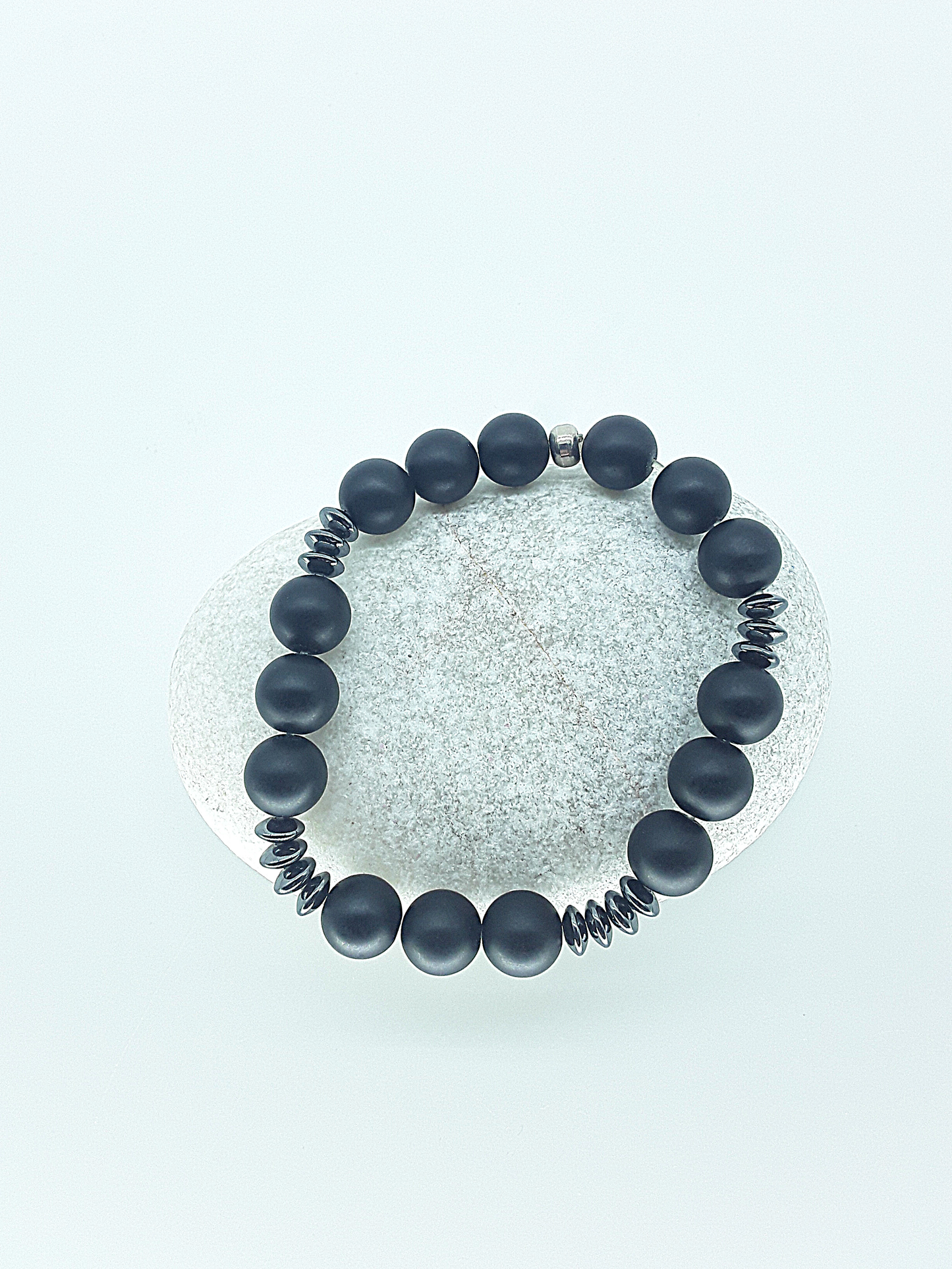 The Fortis Bracelet by Polmadeva – black onyx and hematite bracelet symbolizing strength, grounding, and inner protection