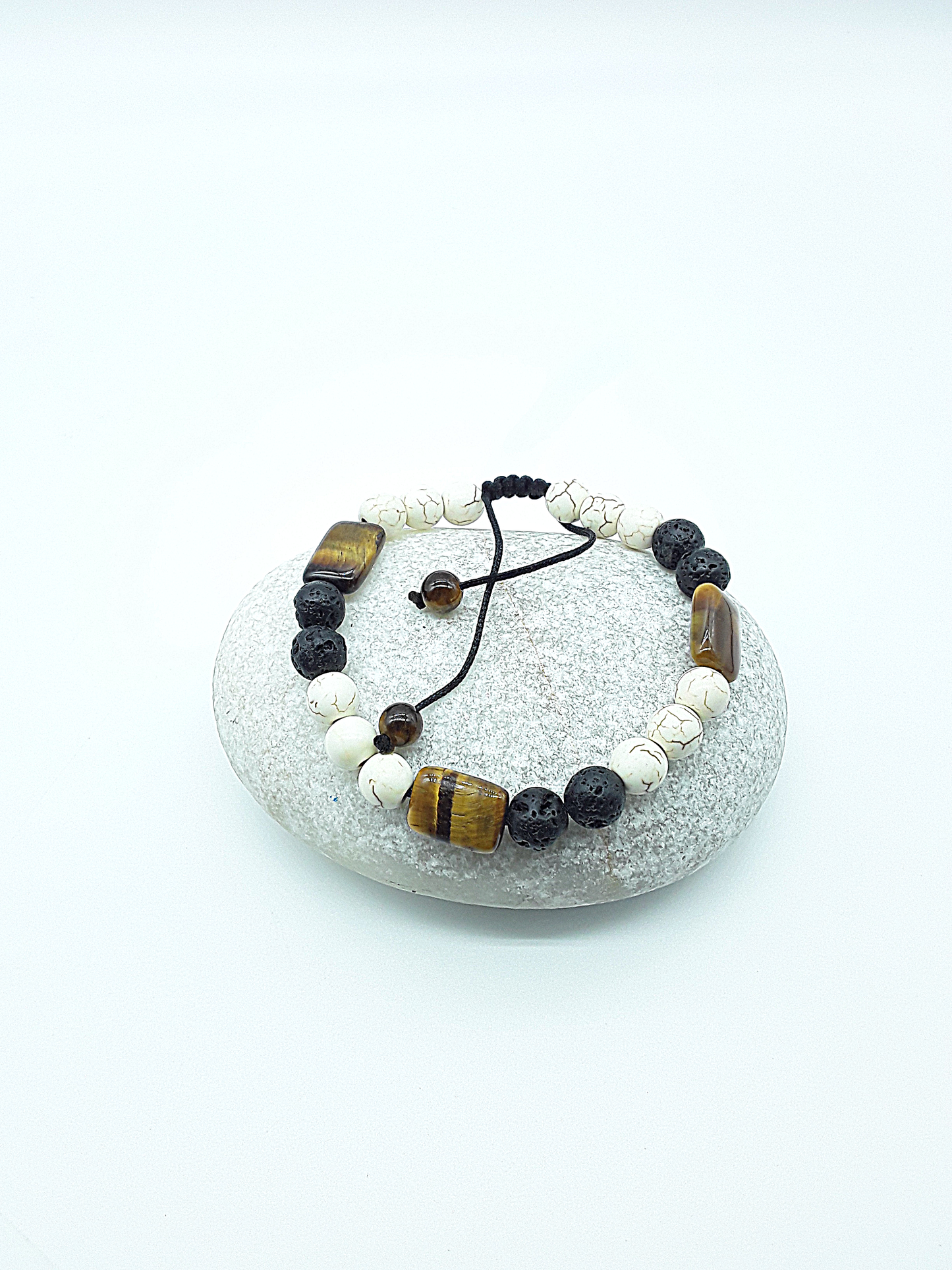 The Stone of Three Paths Set by Polmadeva – handcrafted necklace & bracelet with Lava Stone, Tiger’s Eye & Howlite, symbolizing vision, grounding & harmony.