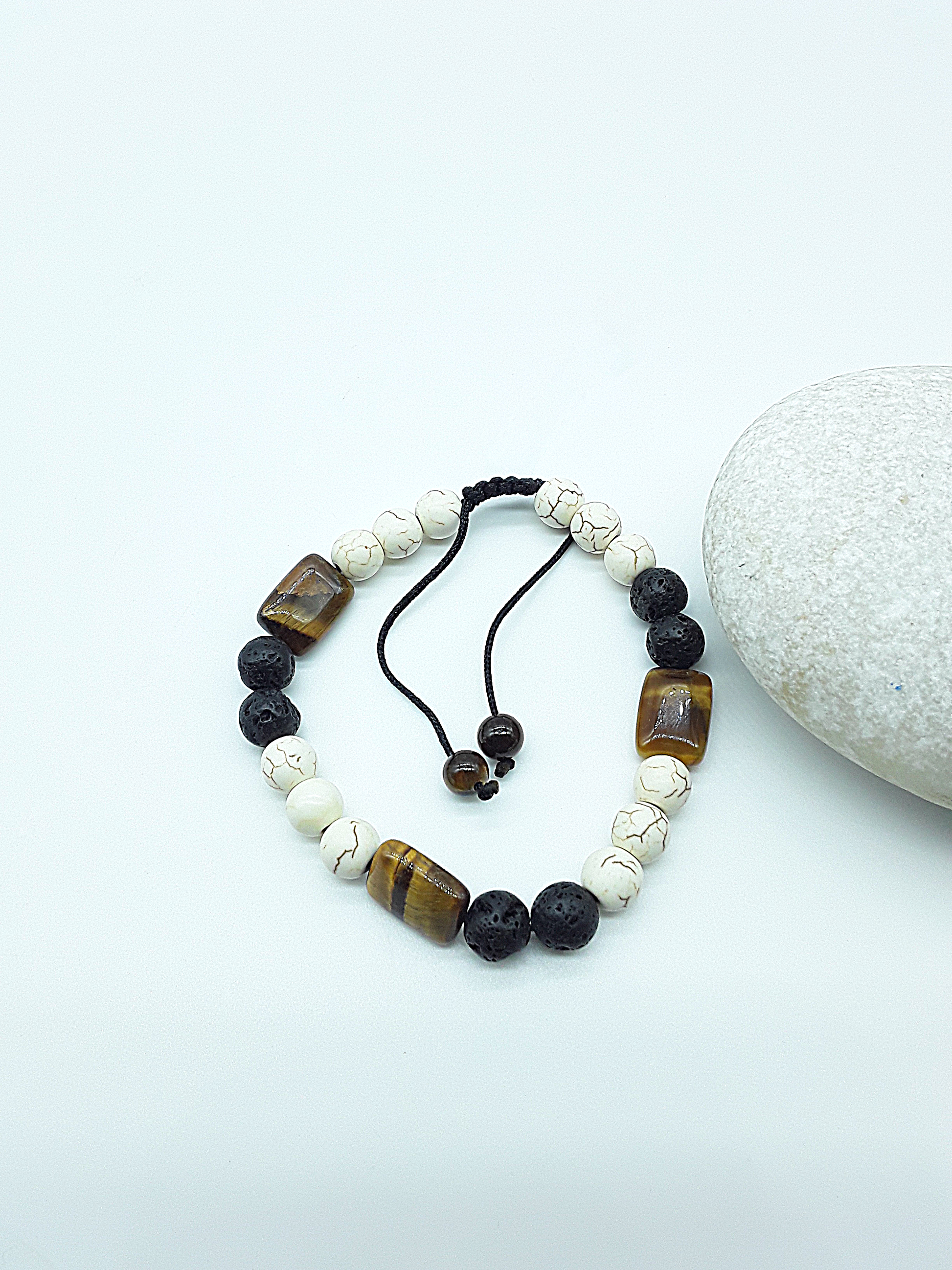 The Stone of Three Paths Set by Polmadeva – handcrafted necklace & bracelet with Lava Stone, Tiger’s Eye & Howlite, symbolizing vision, grounding & harmony.