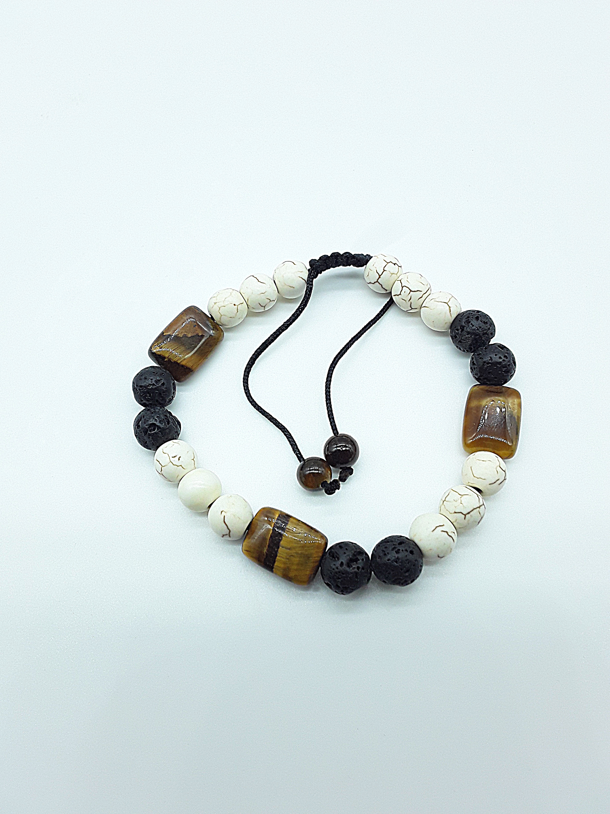 The Stone of Three Paths Set by Polmadeva – handcrafted necklace & bracelet with Lava Stone, Tiger’s Eye & Howlite, symbolizing vision, grounding & harmony.