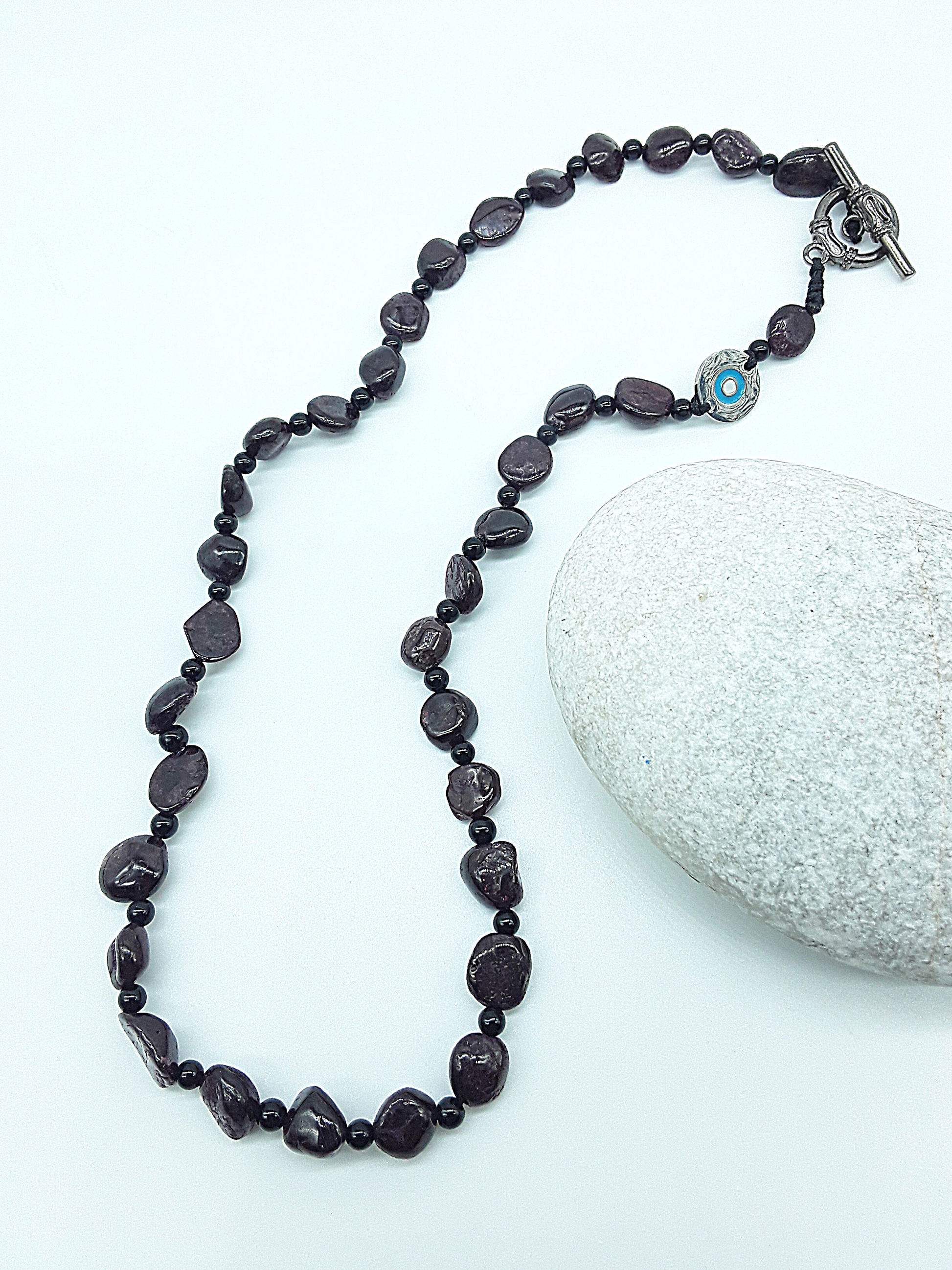 The Sigilguard Necklace by Polmadeva – garnet and onyx necklace with sigil pendant symbolizing protection, courage, and resilience