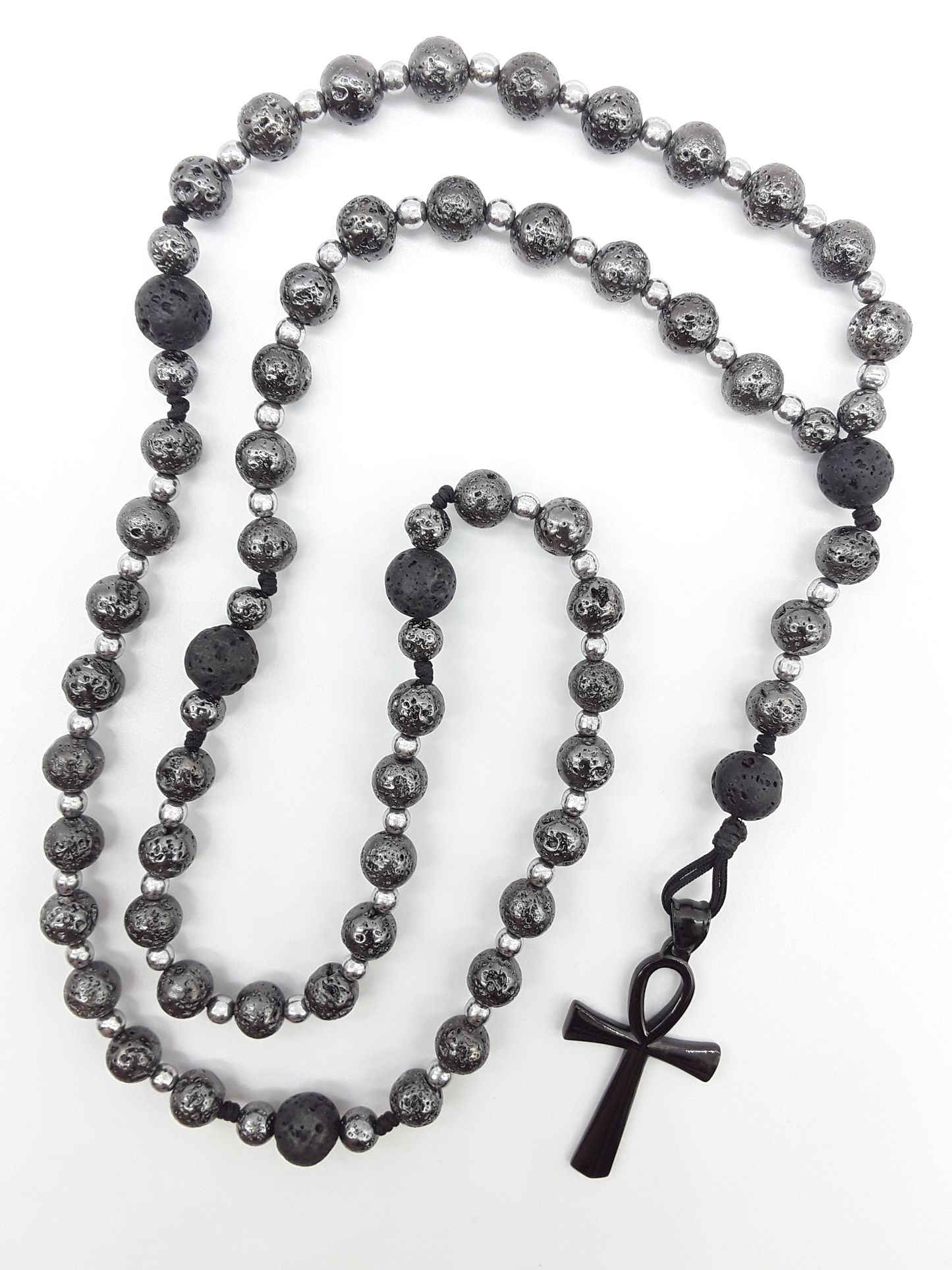 Forged in Continuity lava and hematite Catholic rosary with Ankh cross on white background by Polmadeva