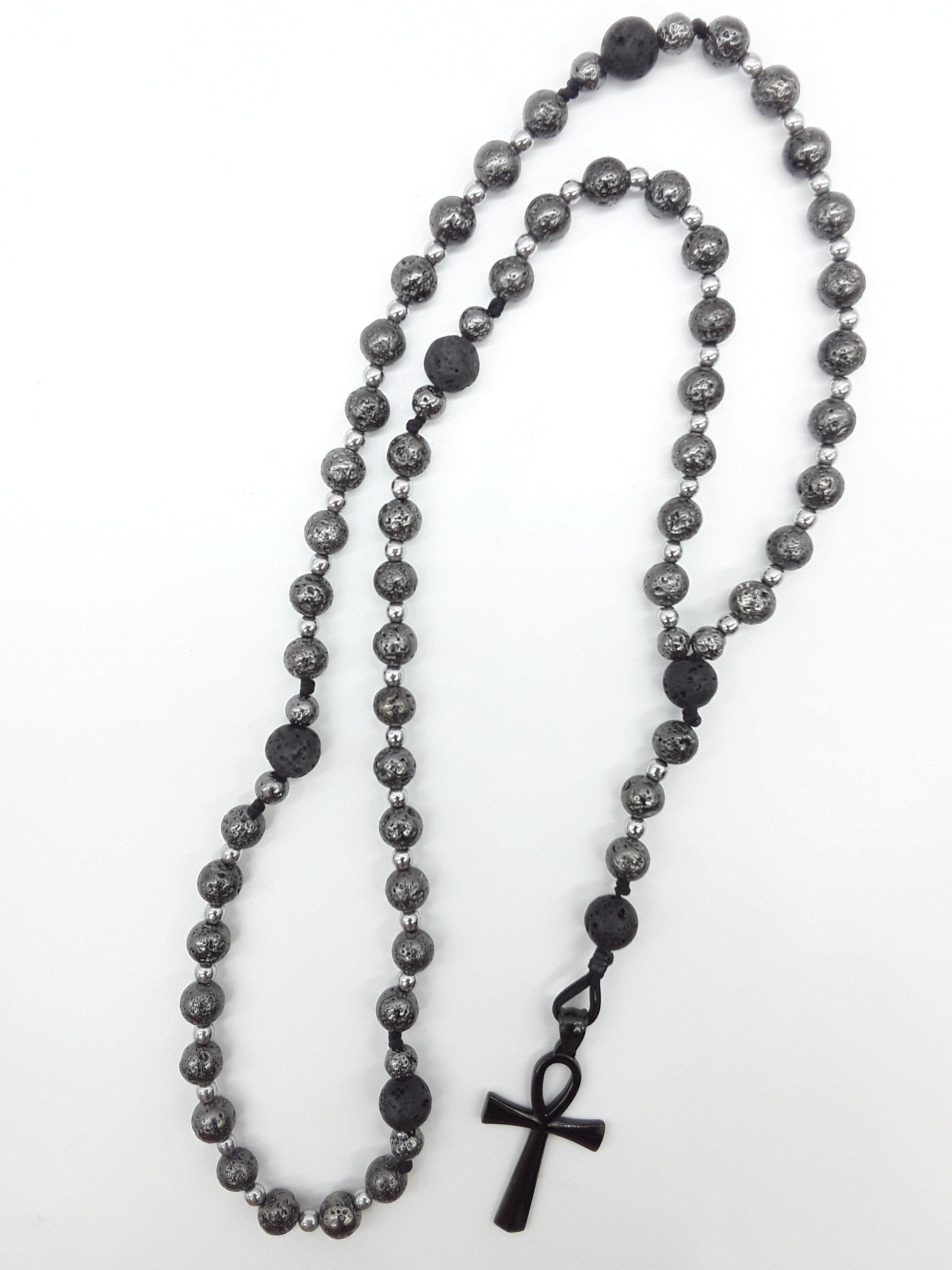 Forged in Continuity lava and hematite Catholic rosary with Ankh cross on white background by Polmadeva