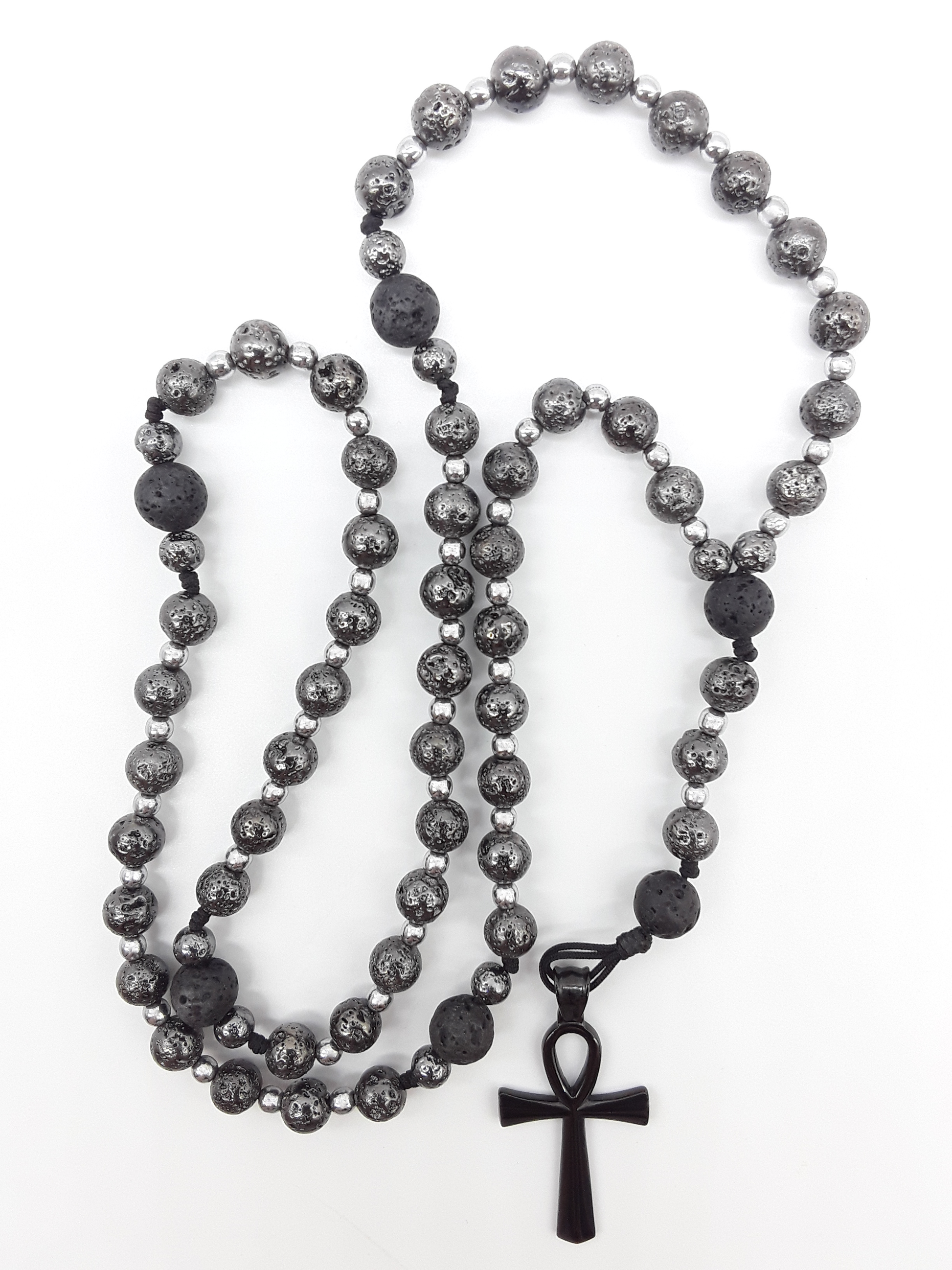 Forged in Continuity lava and hematite Catholic rosary with Ankh cross on white background by Polmadeva