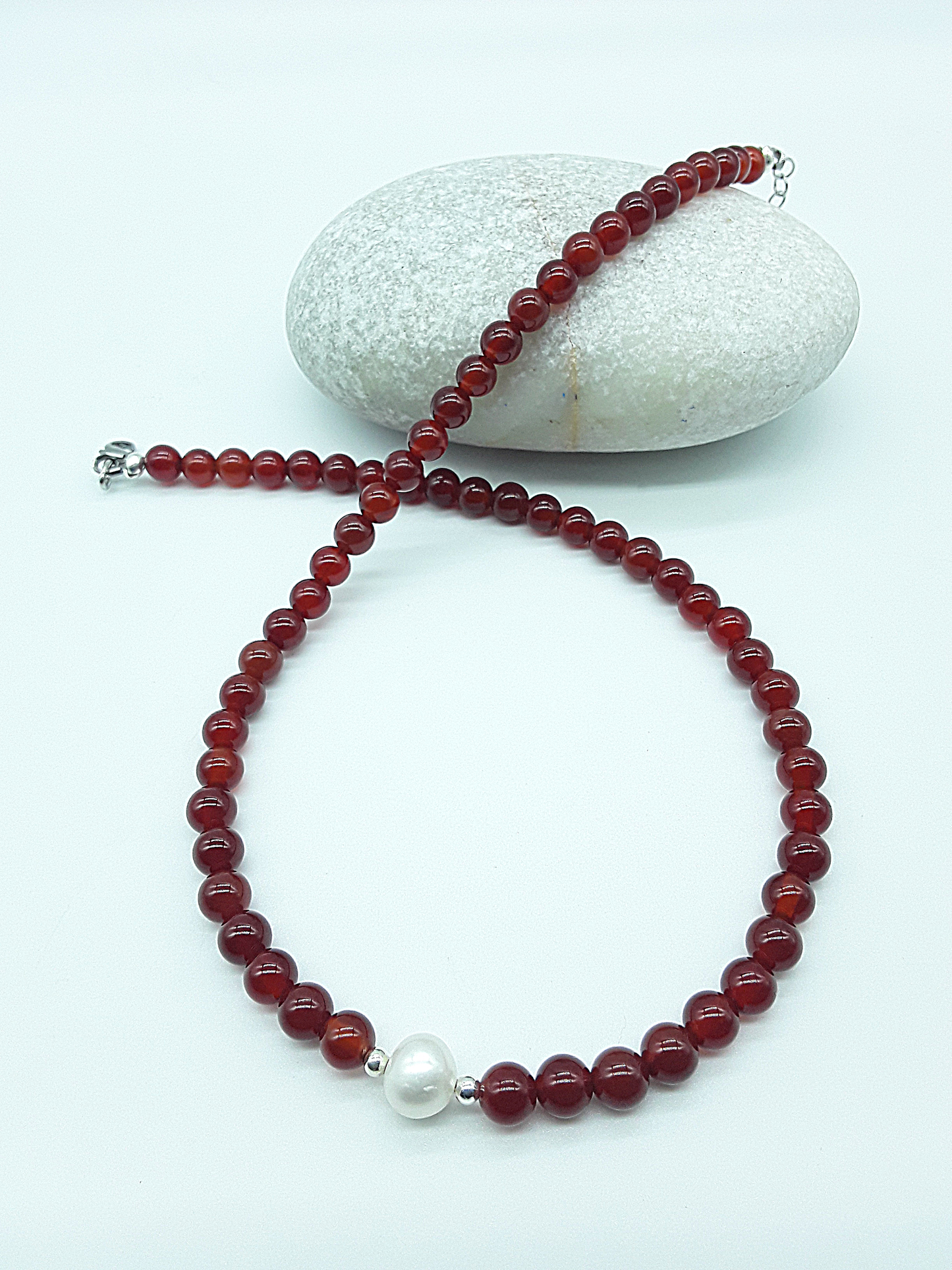 Heartfire Pearl Necklace by Polmadeva styled in a circular form with red carnelian beads and central freshwater pearl, Courage Rising collection